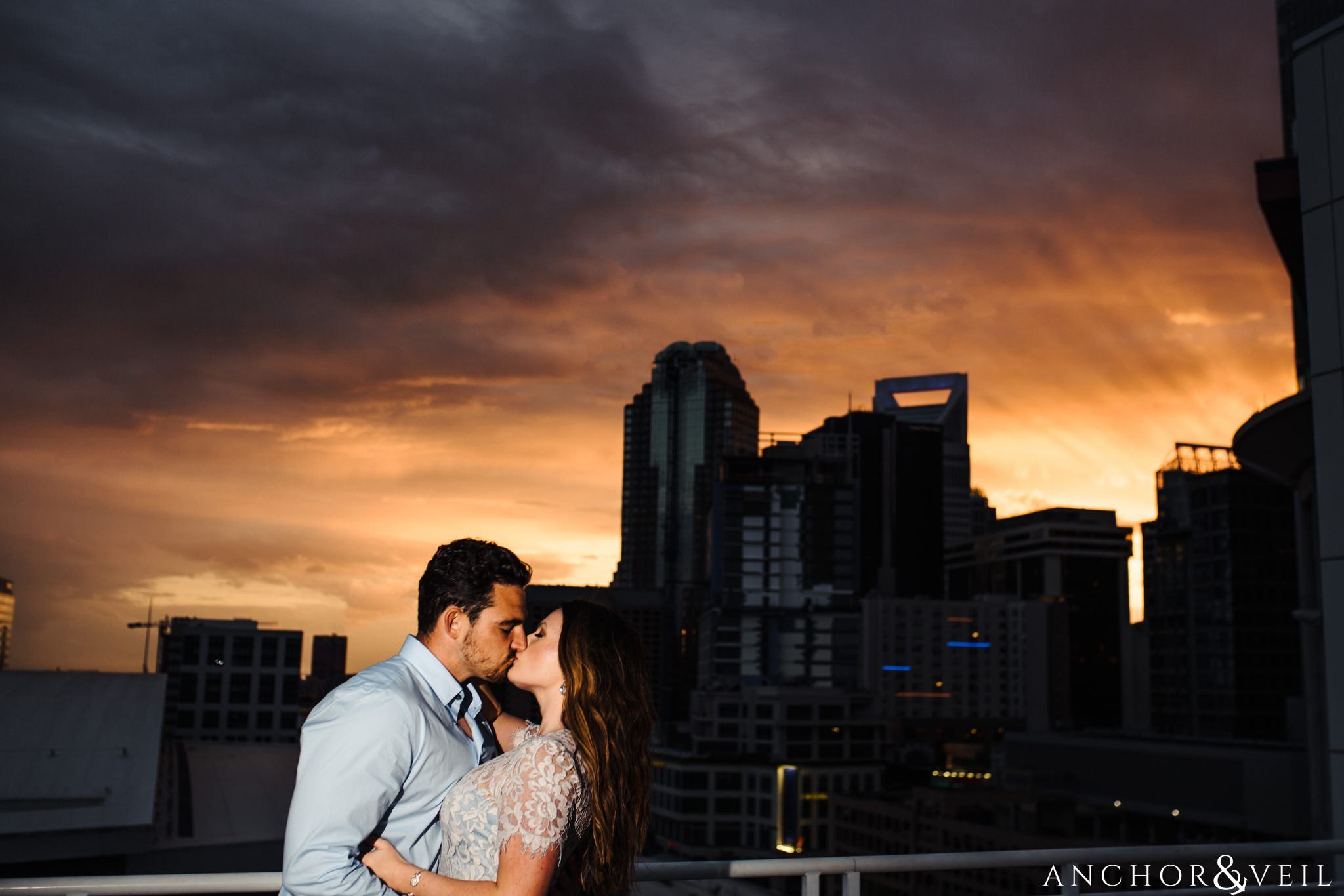 skyline sunset during their Uptown Charlotte NC Engagement Session