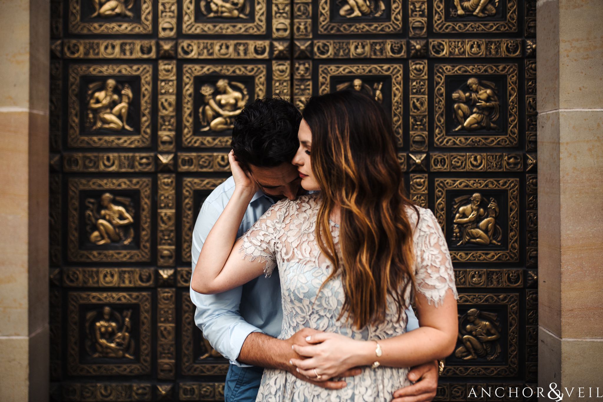 in front of the regal door during their Uptown Charlotte NC Engagement Session