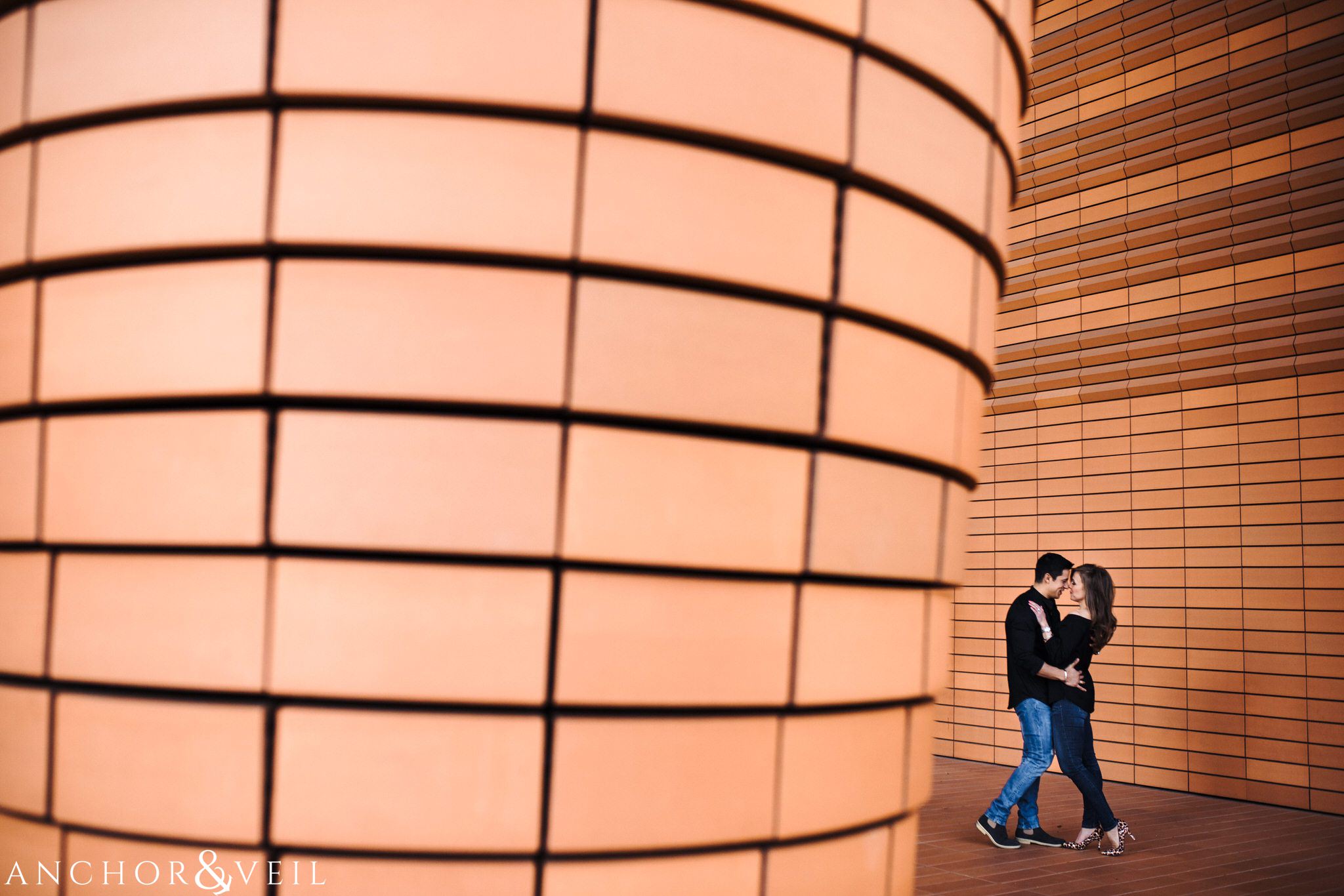 next to the Bechtler Museum During their Uptown Charlotte Engagement Session