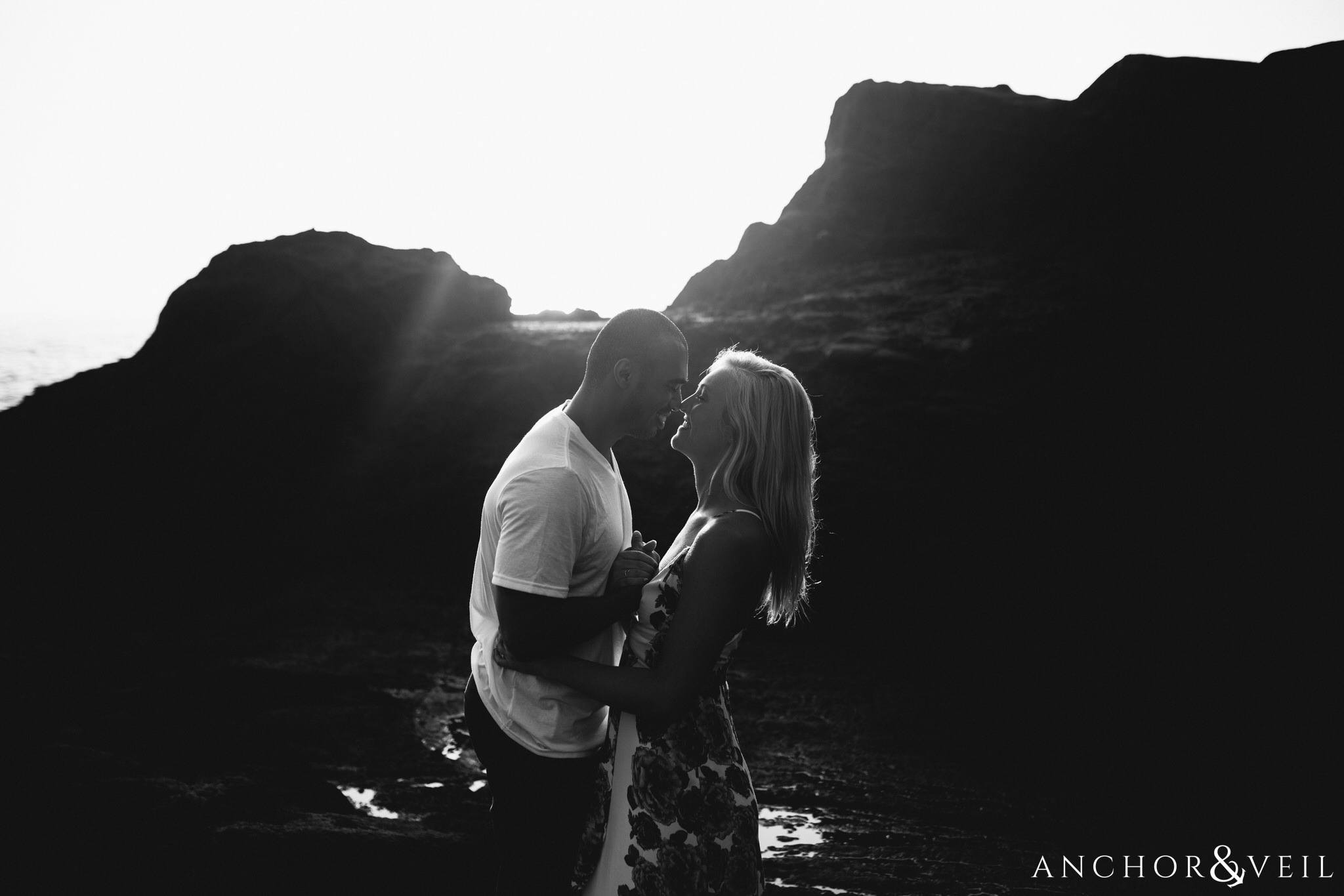 getting close in black and white during their Eternity Beach Session in Honolulu Hawaii Halona Cove