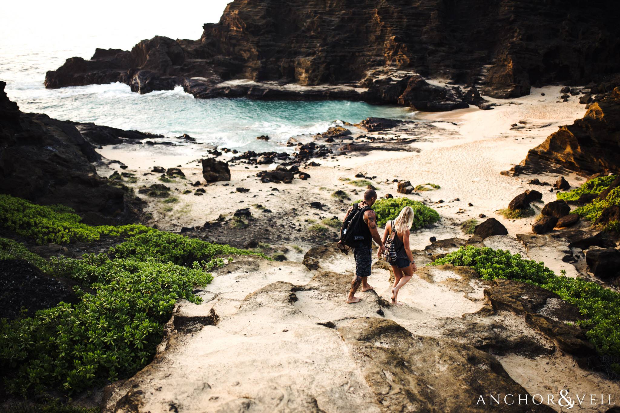 walking the path during their Eternity Beach Session in Honolulu Hawaii Halona Cove