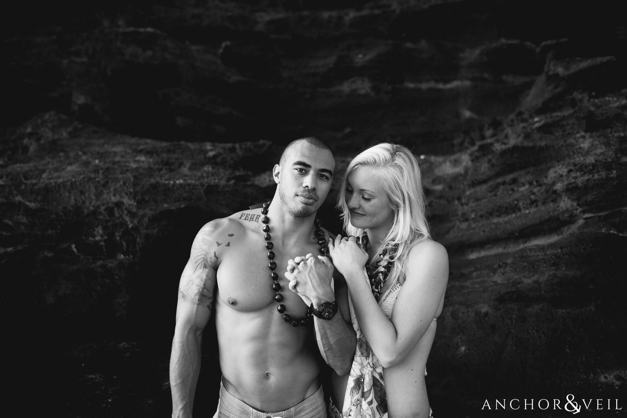 holding each other tight during their Eternity Beach Session in Honolulu Hawaii Halona Cove