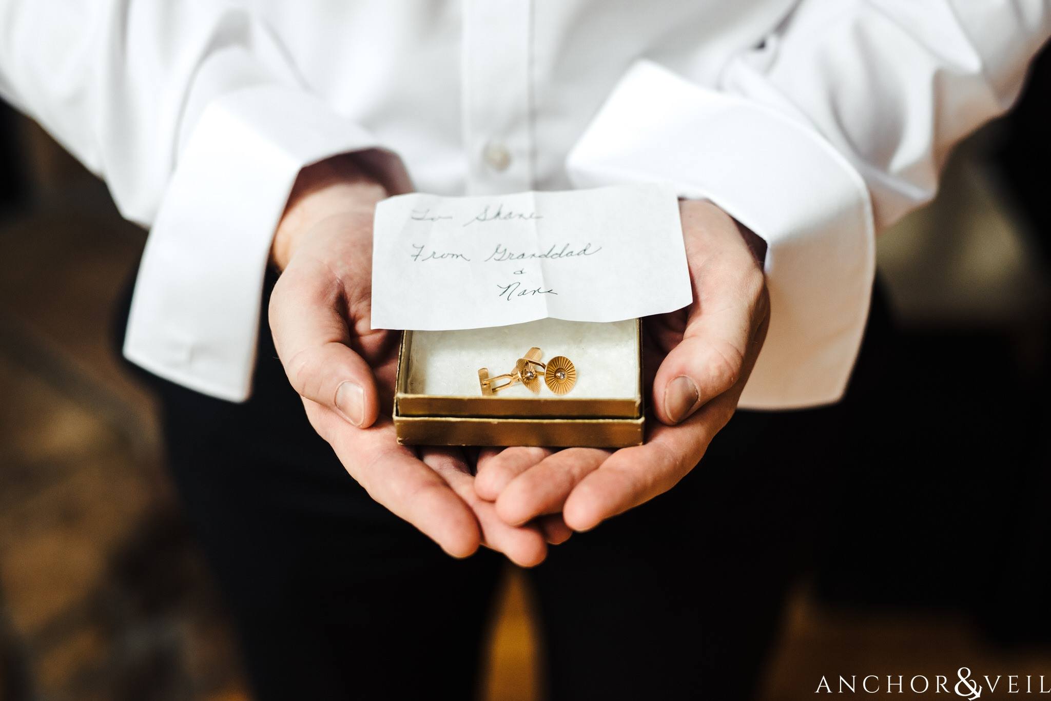 groom holding cuff links during their Horseshoe Bend Elopement Wedding
