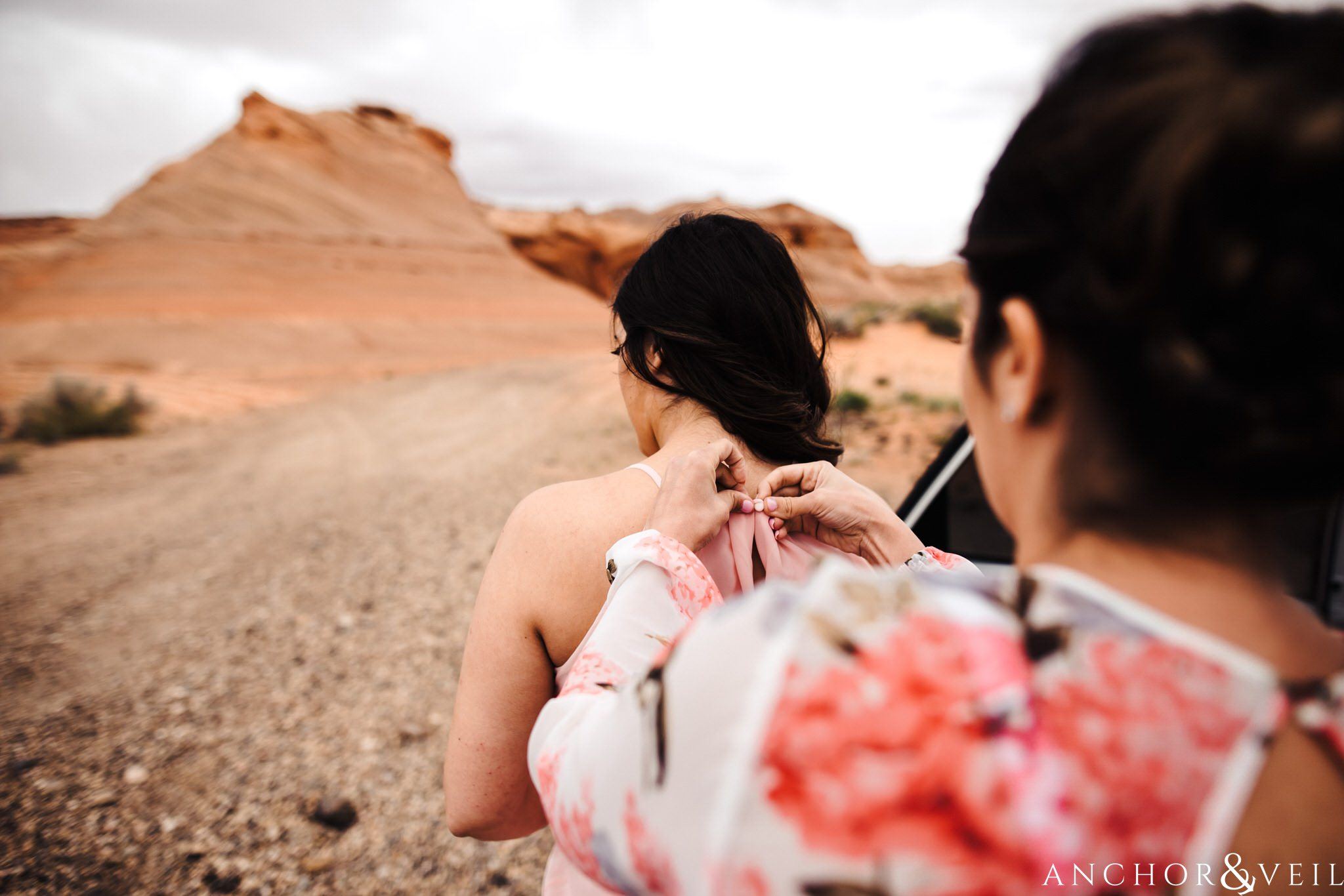 getting dress on during their Horseshoe Bend Elopement Wedding