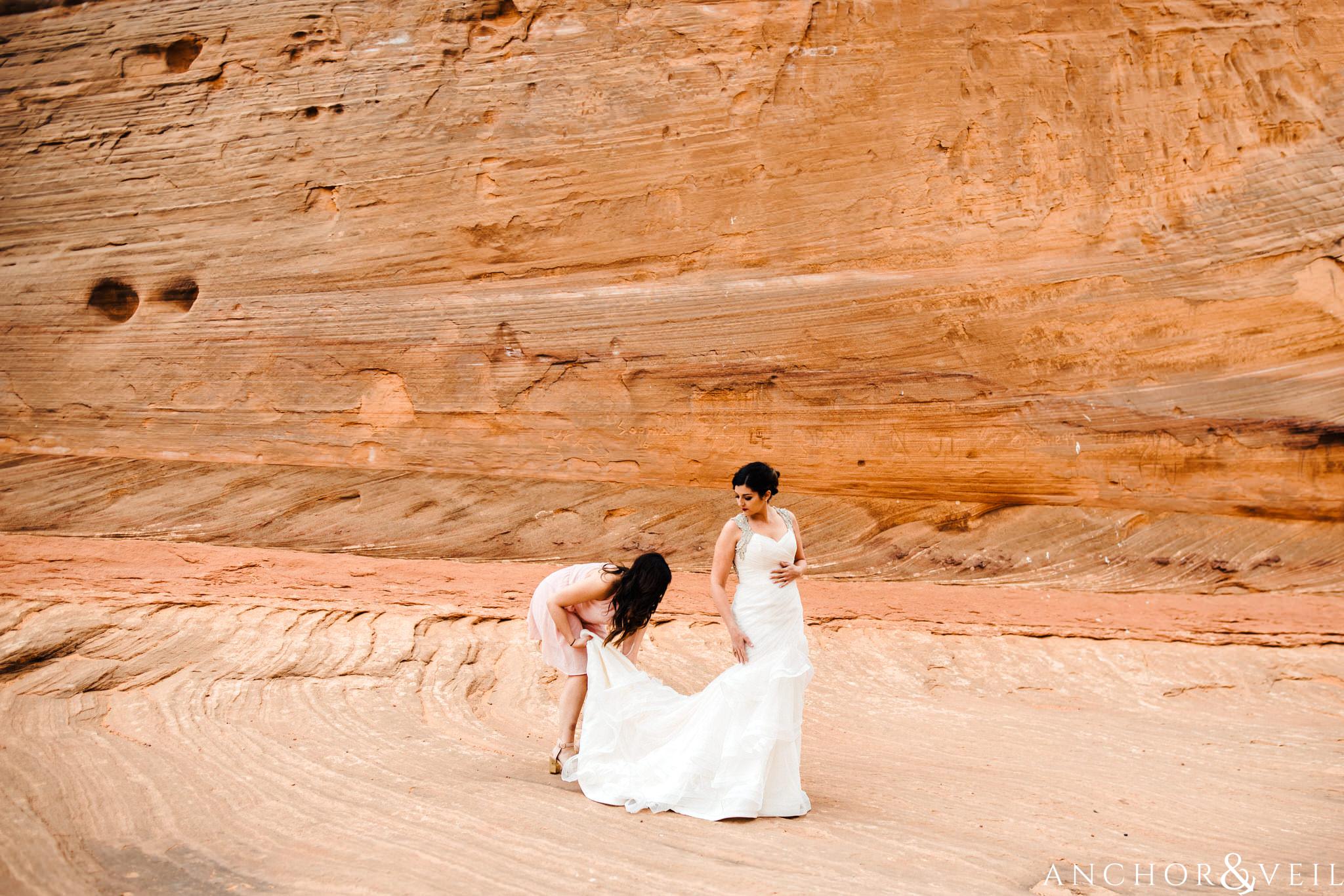 putting on the dress during their Horseshoe Bend Elopement Wedding