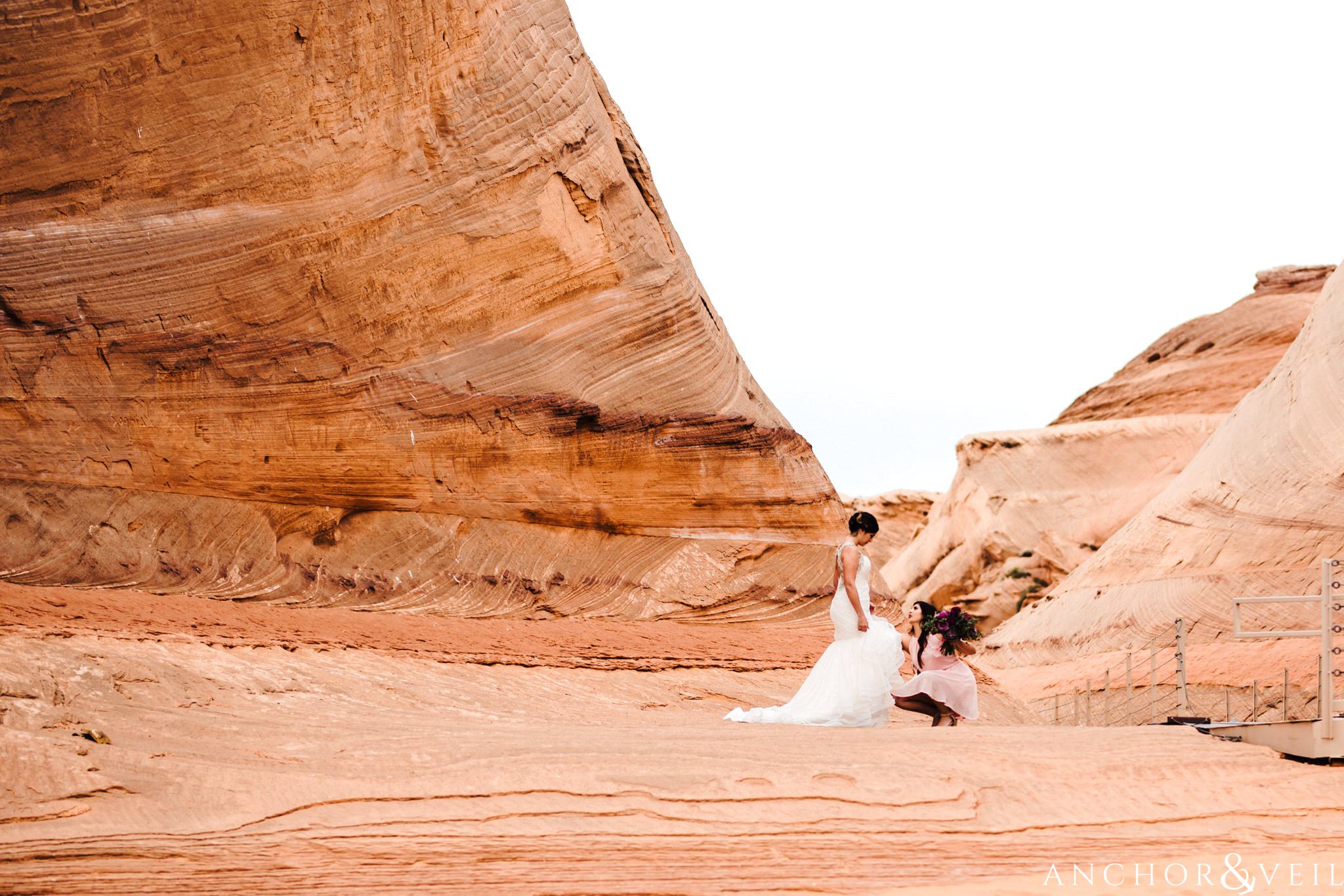 finishing touches of the dress during their Horseshoe Bend Elopement Wedding