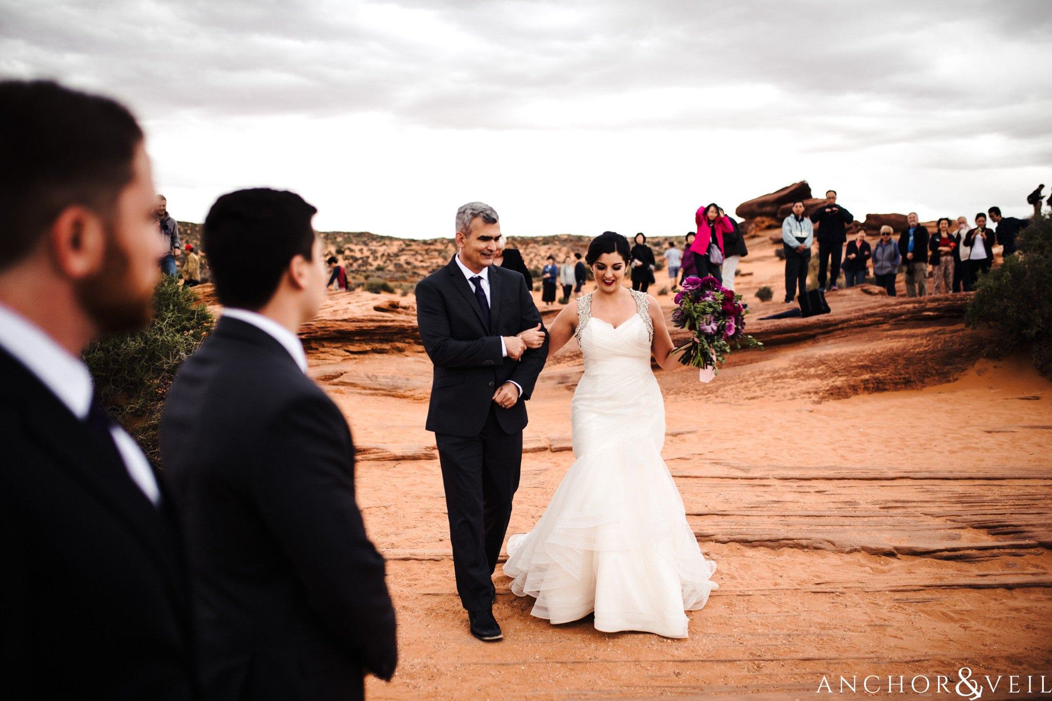dad walking her down the aisle during their Horseshoe Bend Elopement Wedding
