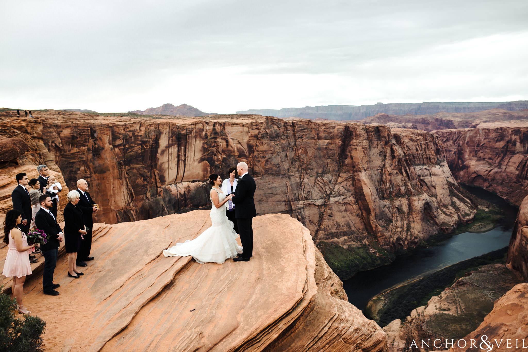 on the edge during their Horseshoe Bend Elopement Wedding