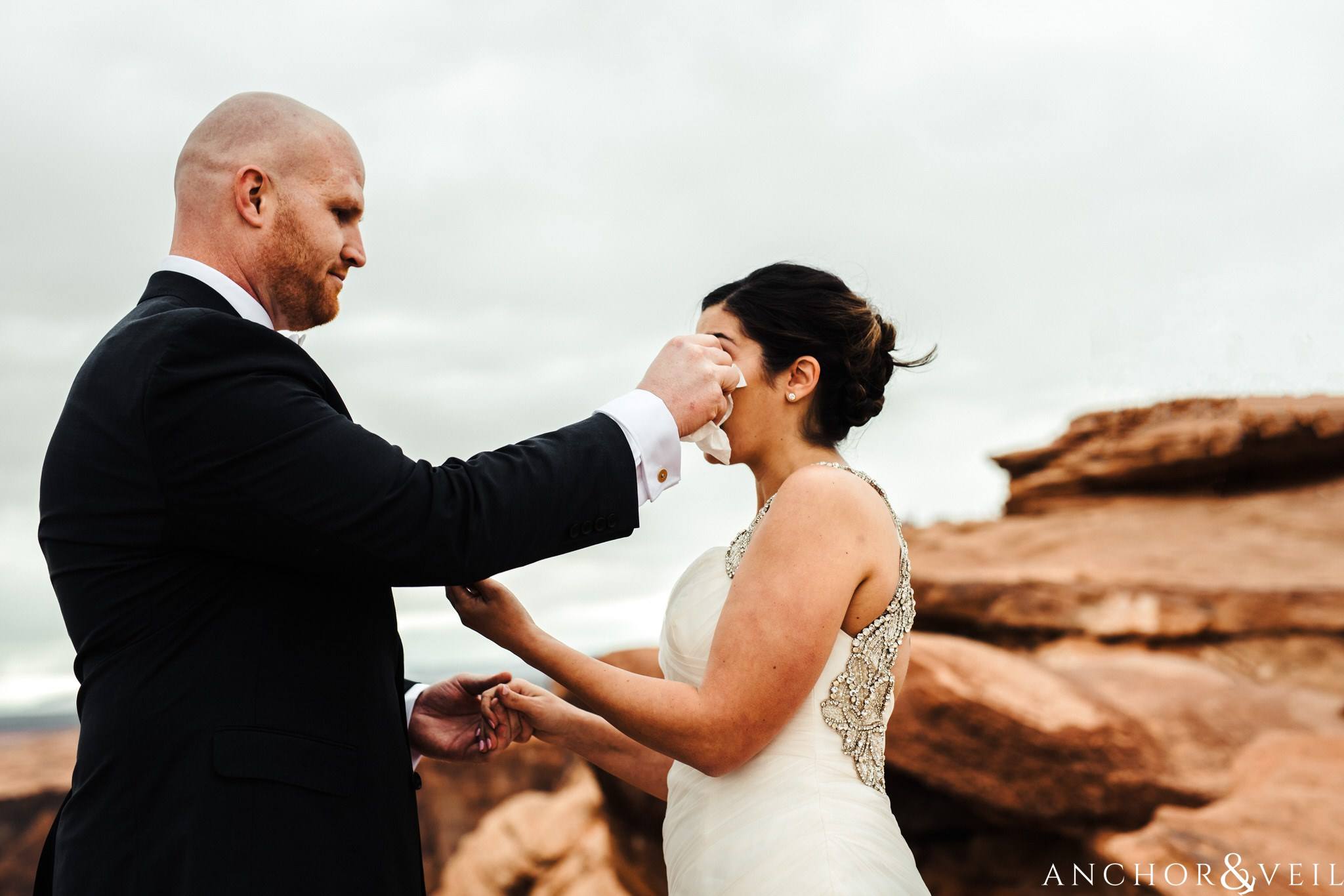 wiping away her tears during their Horseshoe Bend Elopement Wedding