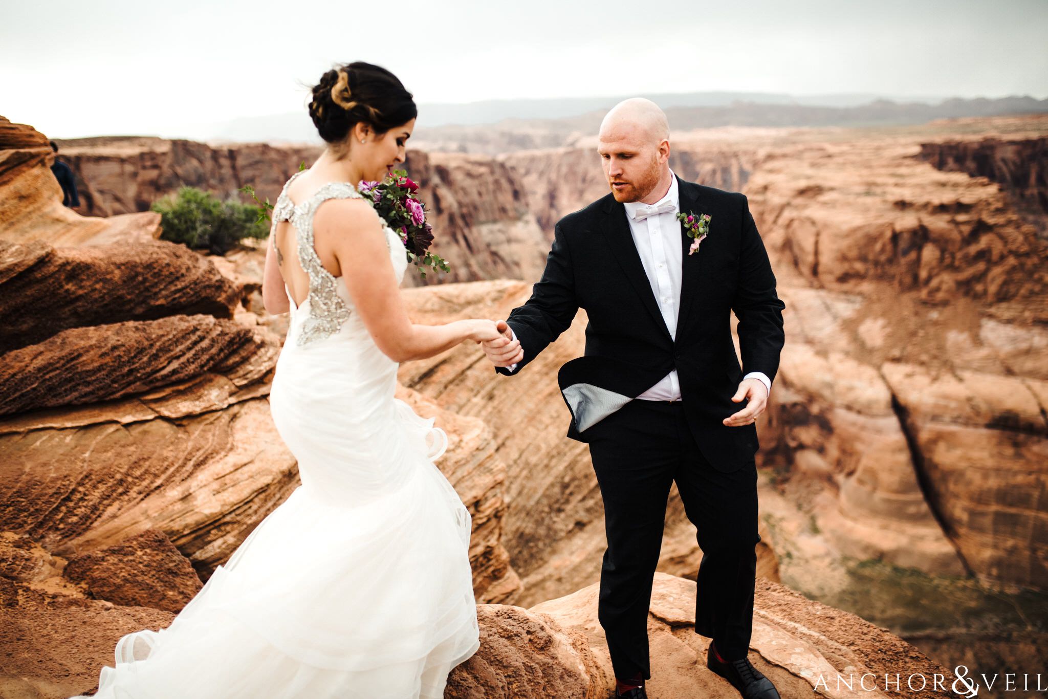 a helping hand during their Horseshoe Bend Elopement Wedding