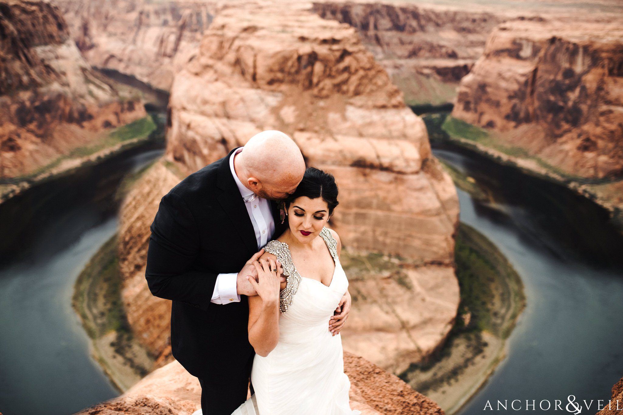 holding her close during their Horseshoe Bend Elopement Wedding