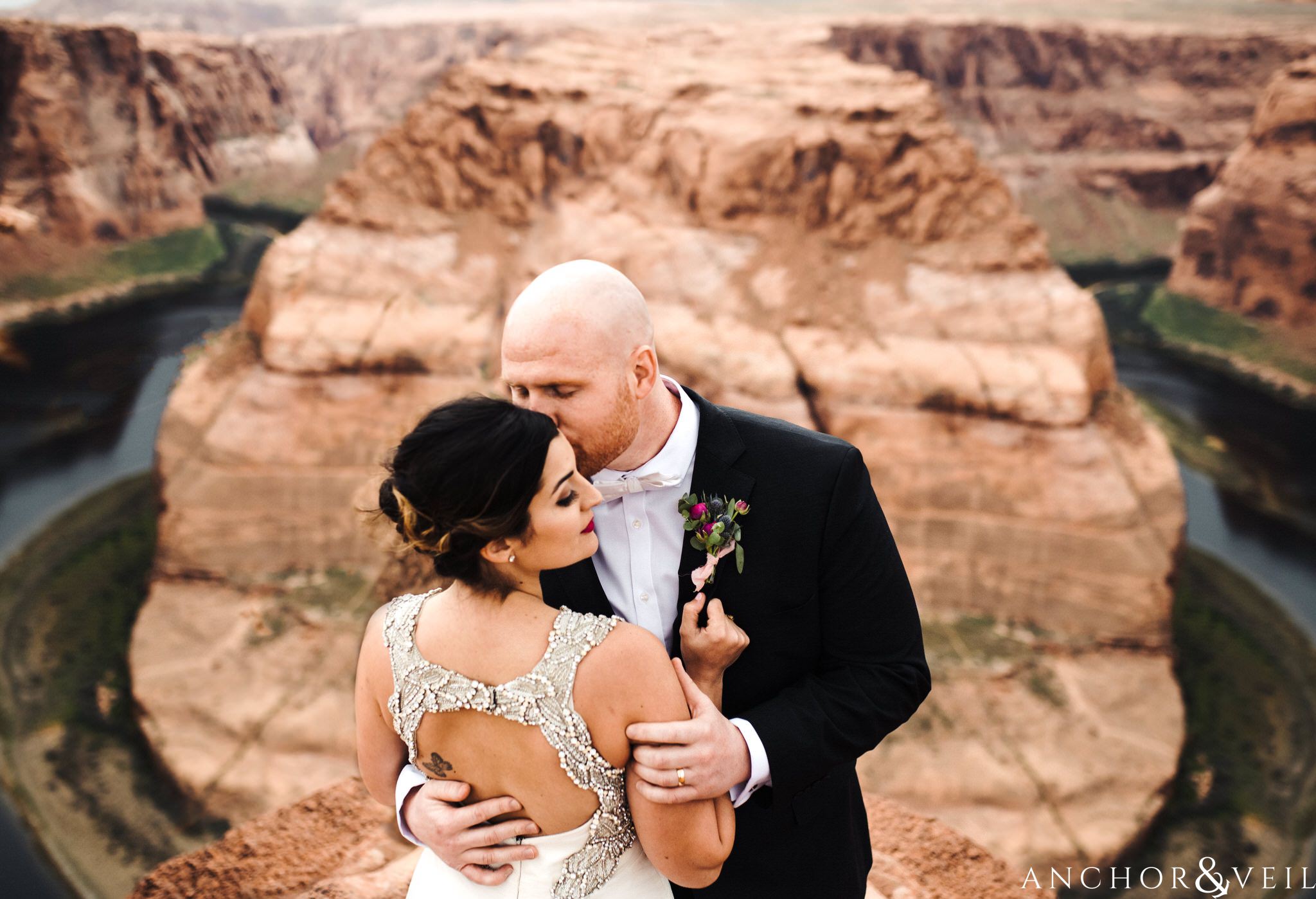 holding close and kissing during their Horseshoe Bend Elopement Wedding