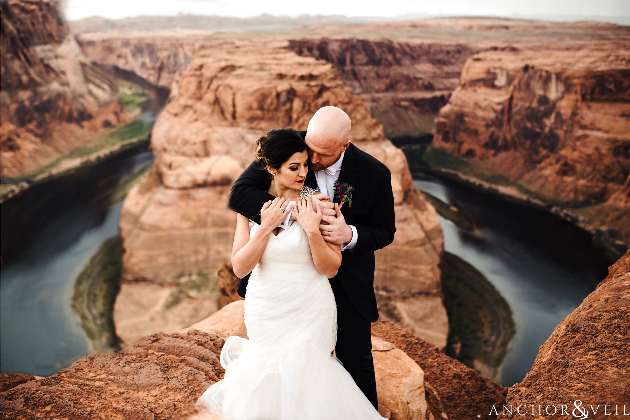 holding her from behind during their Horseshoe Bend Elopement Wedding