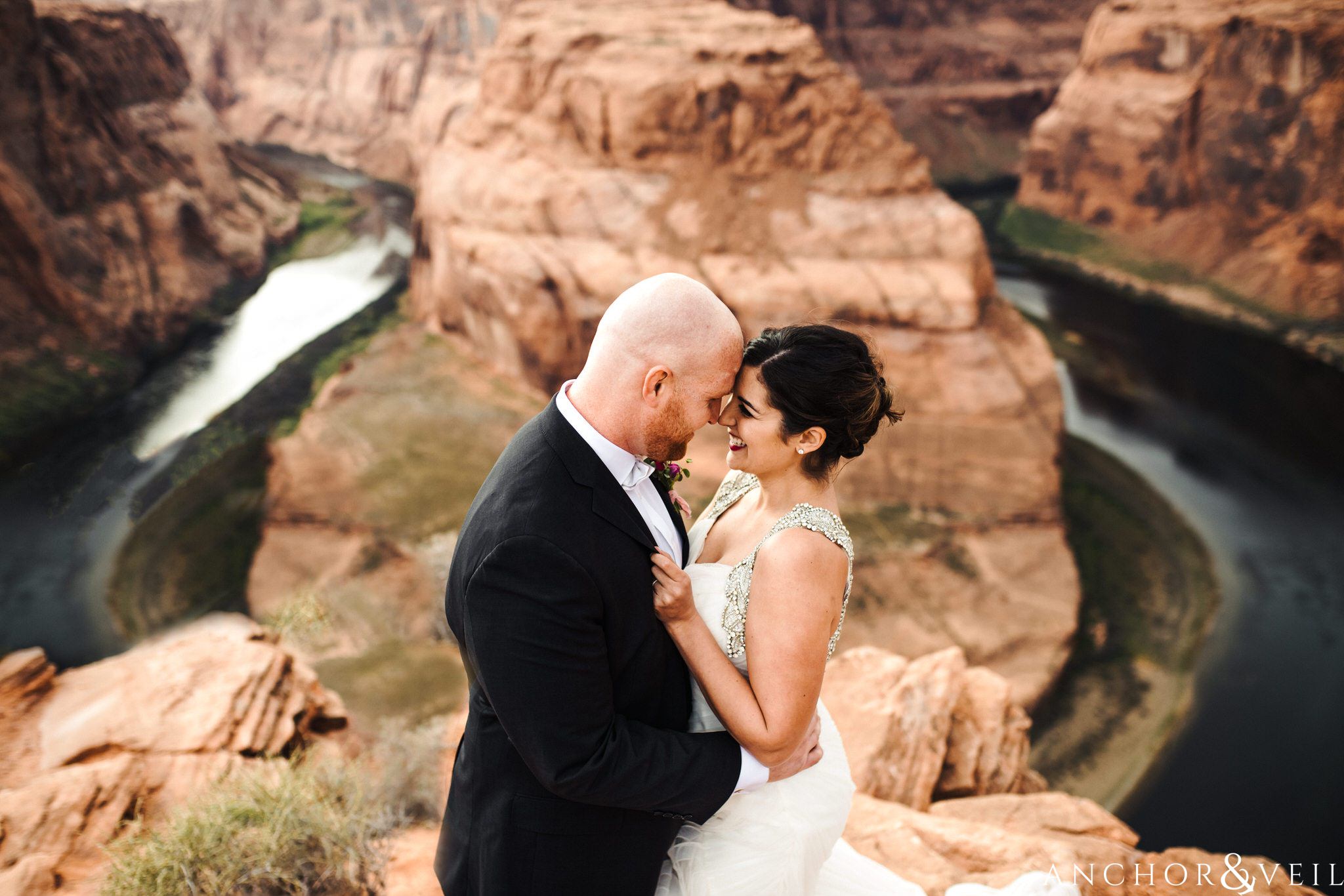 foreheads and smiles on the edge during their Horseshoe Bend Elopement Wedding