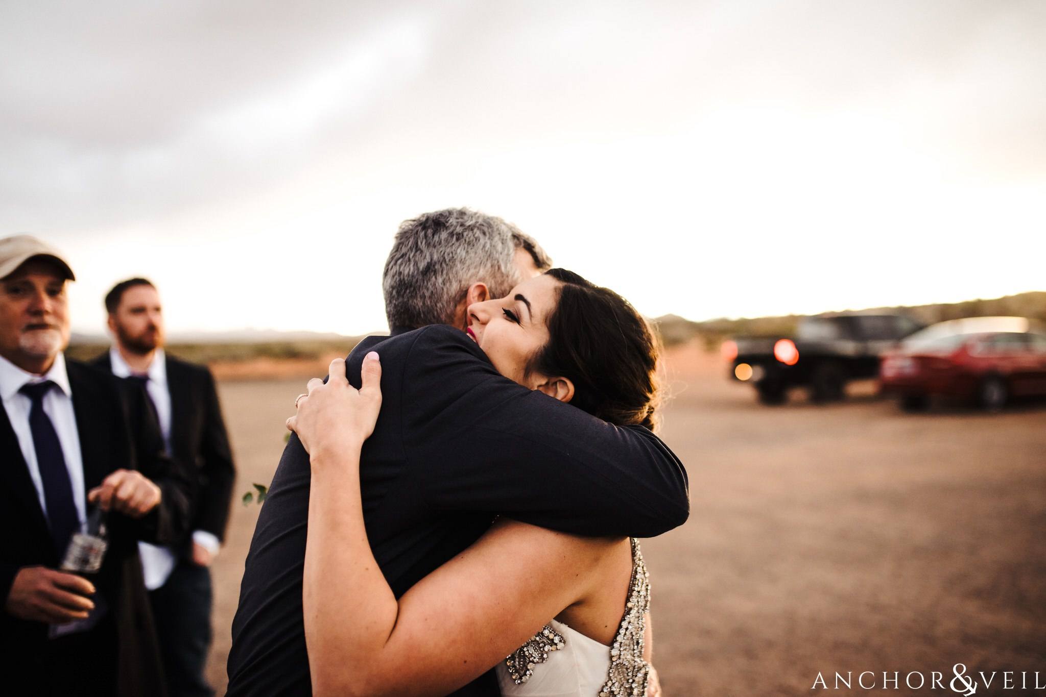 dad hugging daughter during their Horseshoe Bend Elopement Wedding