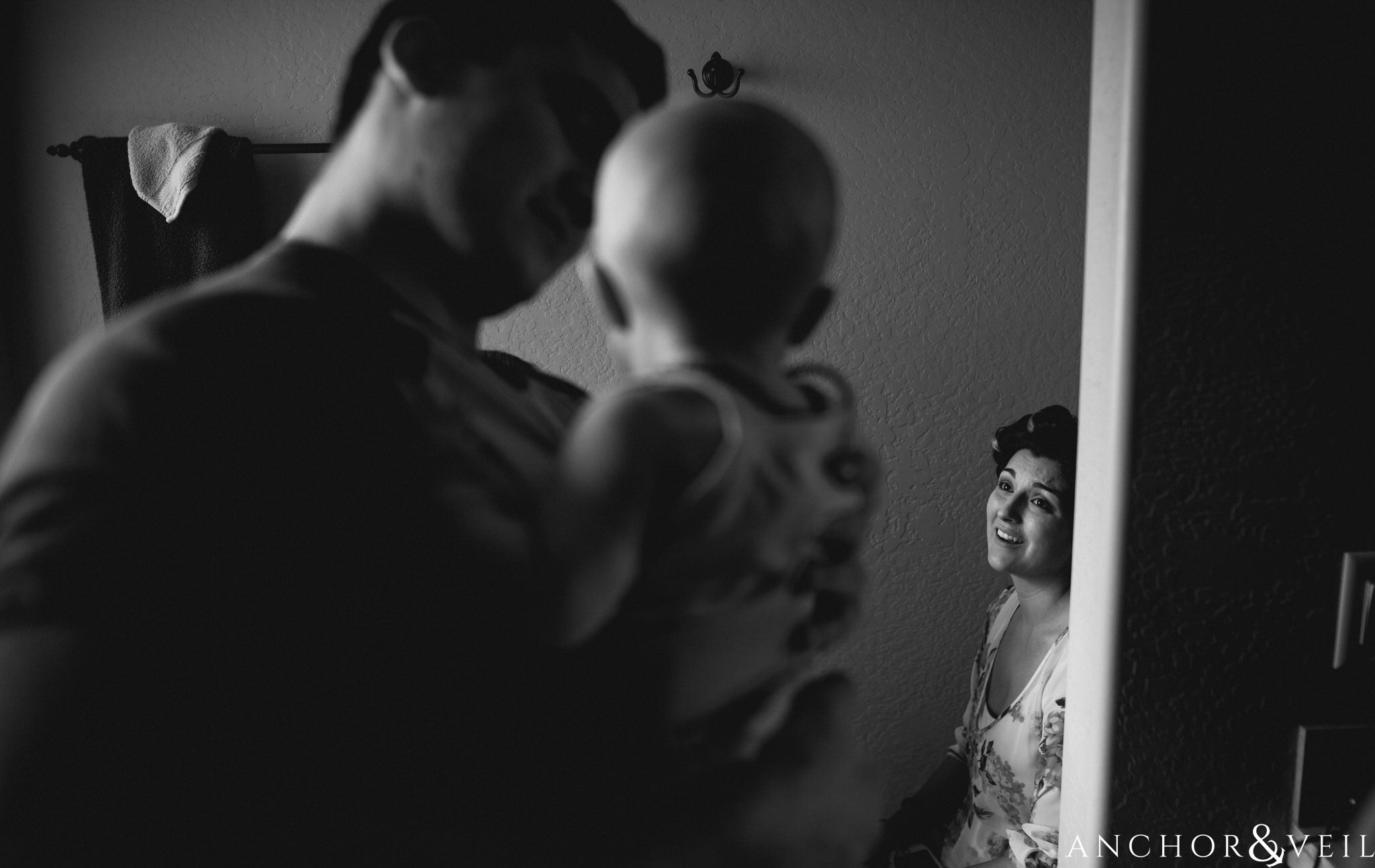 mom seeing baby while she gets makeup on during their Horseshoe Bend Elopement Wedding