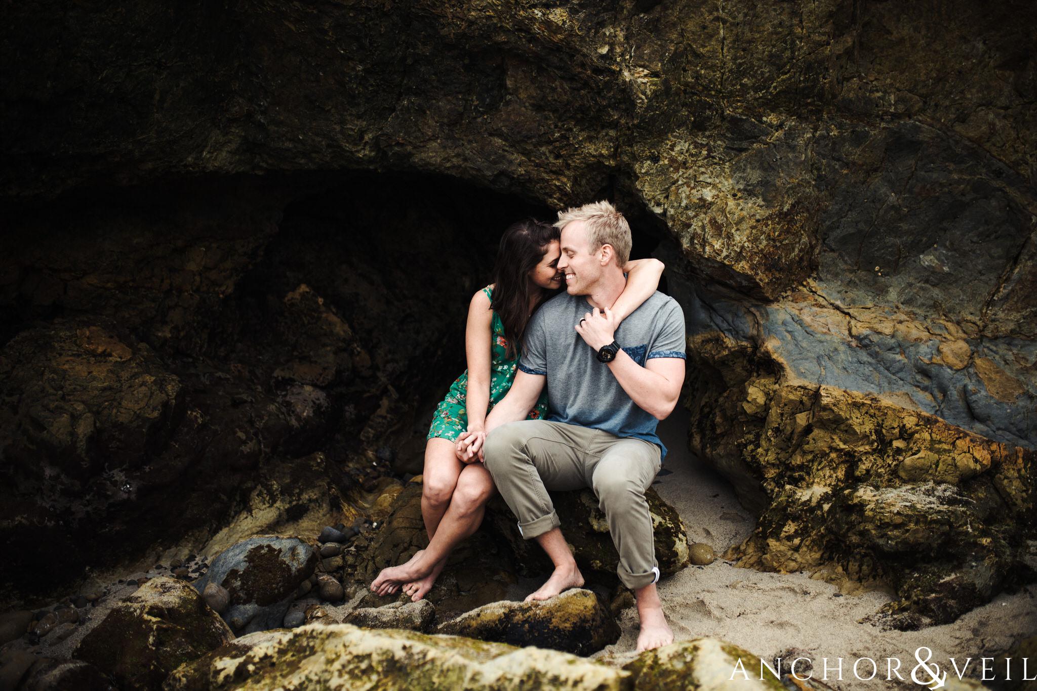in the cave during their Laguna Beach Engagement Session 