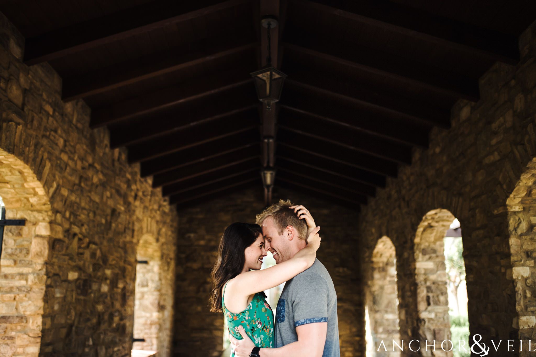 under the arches during their Laguna Beach Engagement Session 35