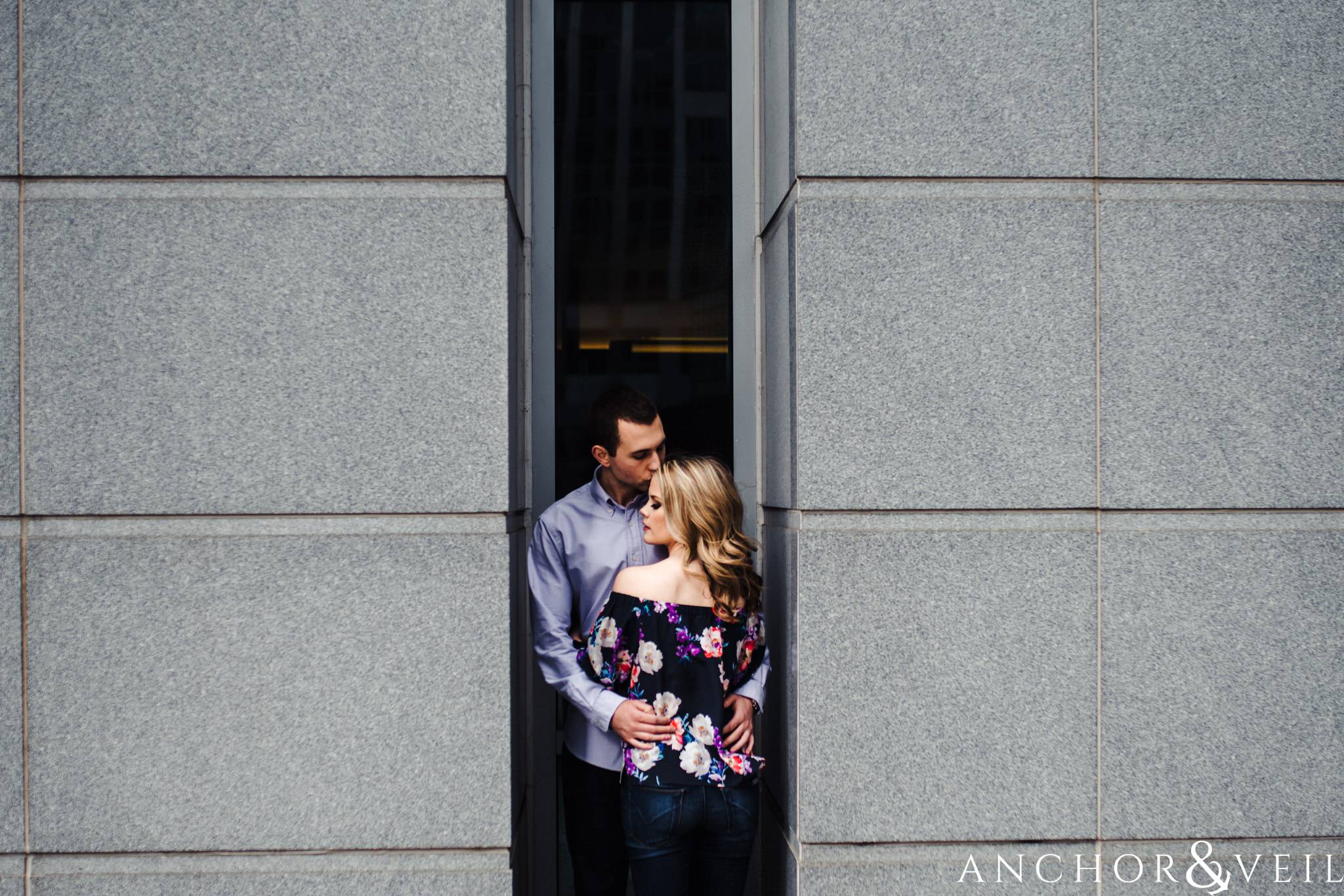 between the walls during their Uptown Charlotte Engagment Session The Green 1