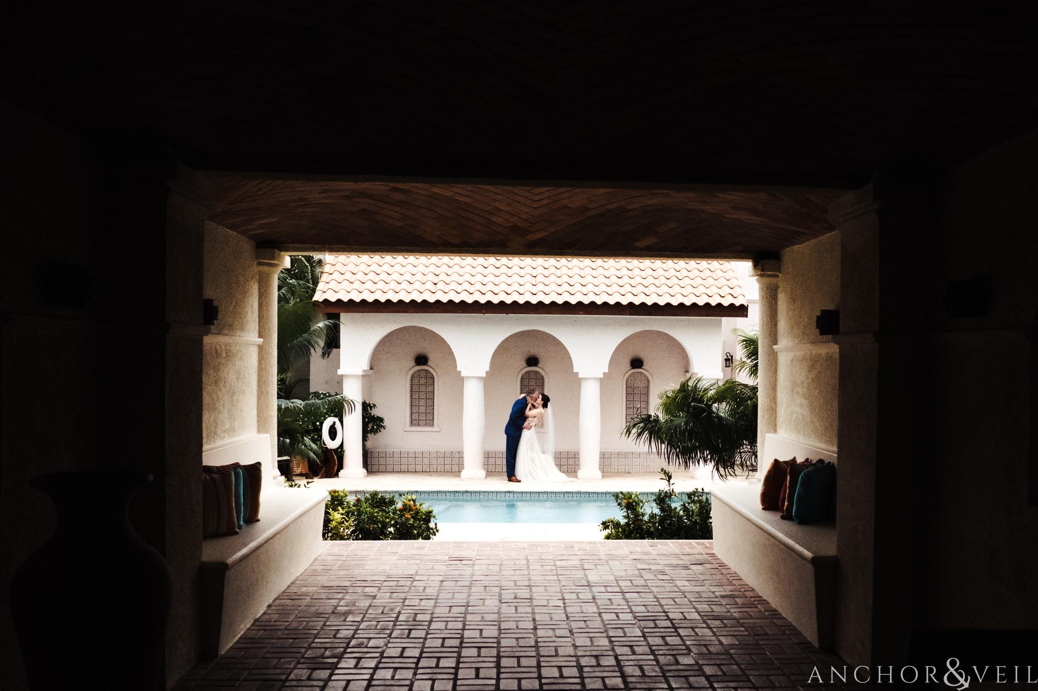 bride and groom by the pool During their Cap Maison destination Wedding In St Lucia