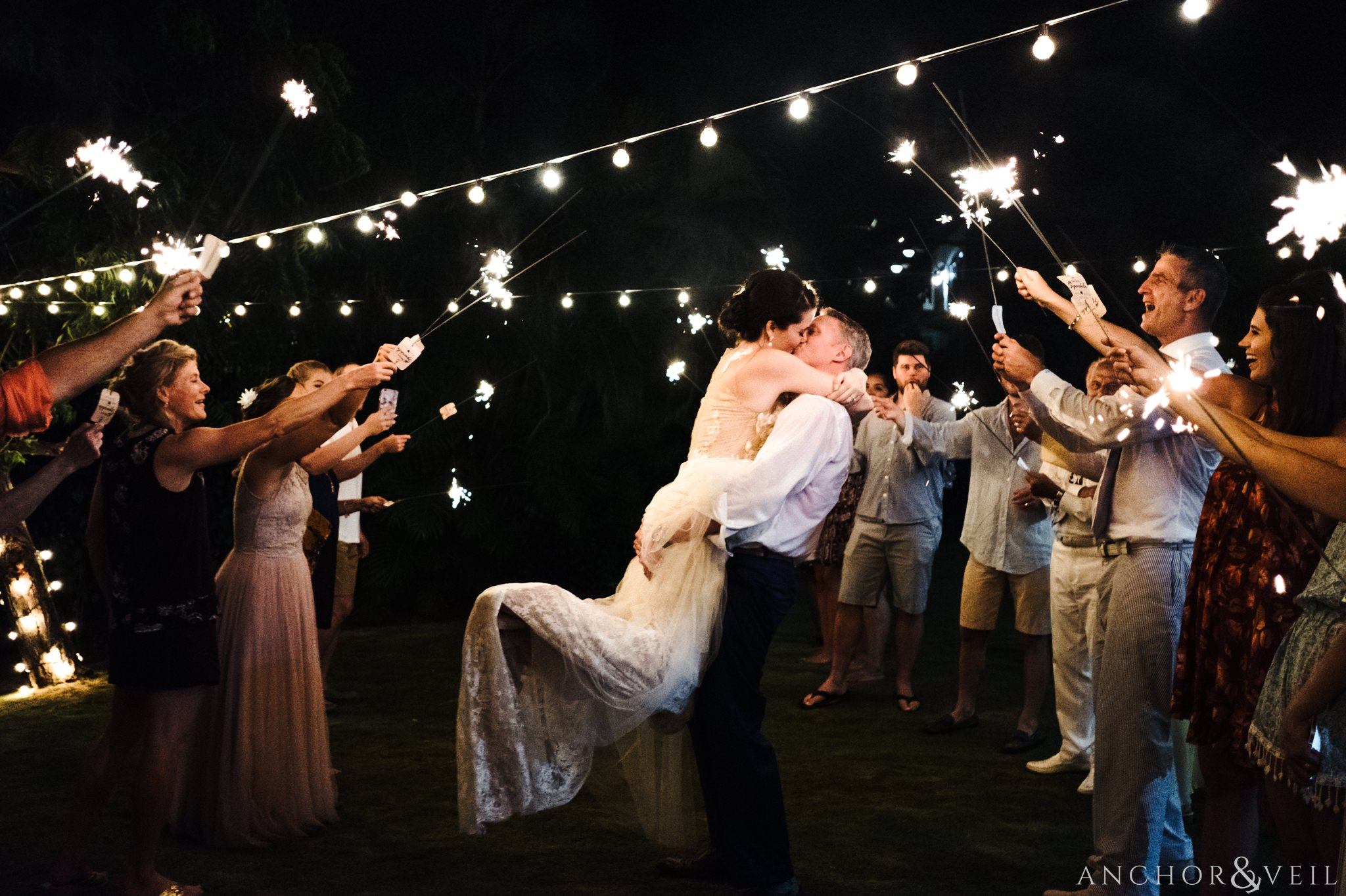 sparkler exit jumping and holding During their Cap Maison destination Wedding In St Lucia