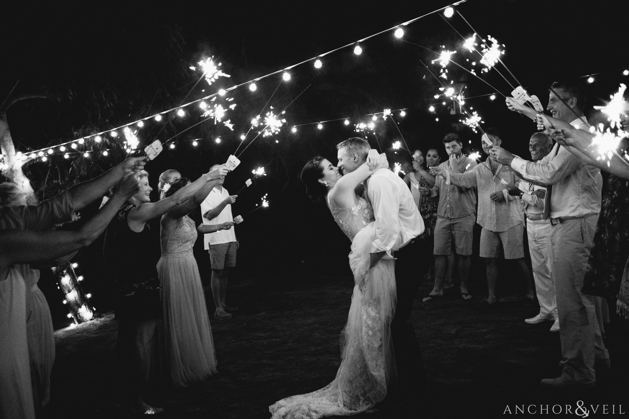 bringing in close during the sparkler exit During their Cap Maison destination Wedding In St Lucia