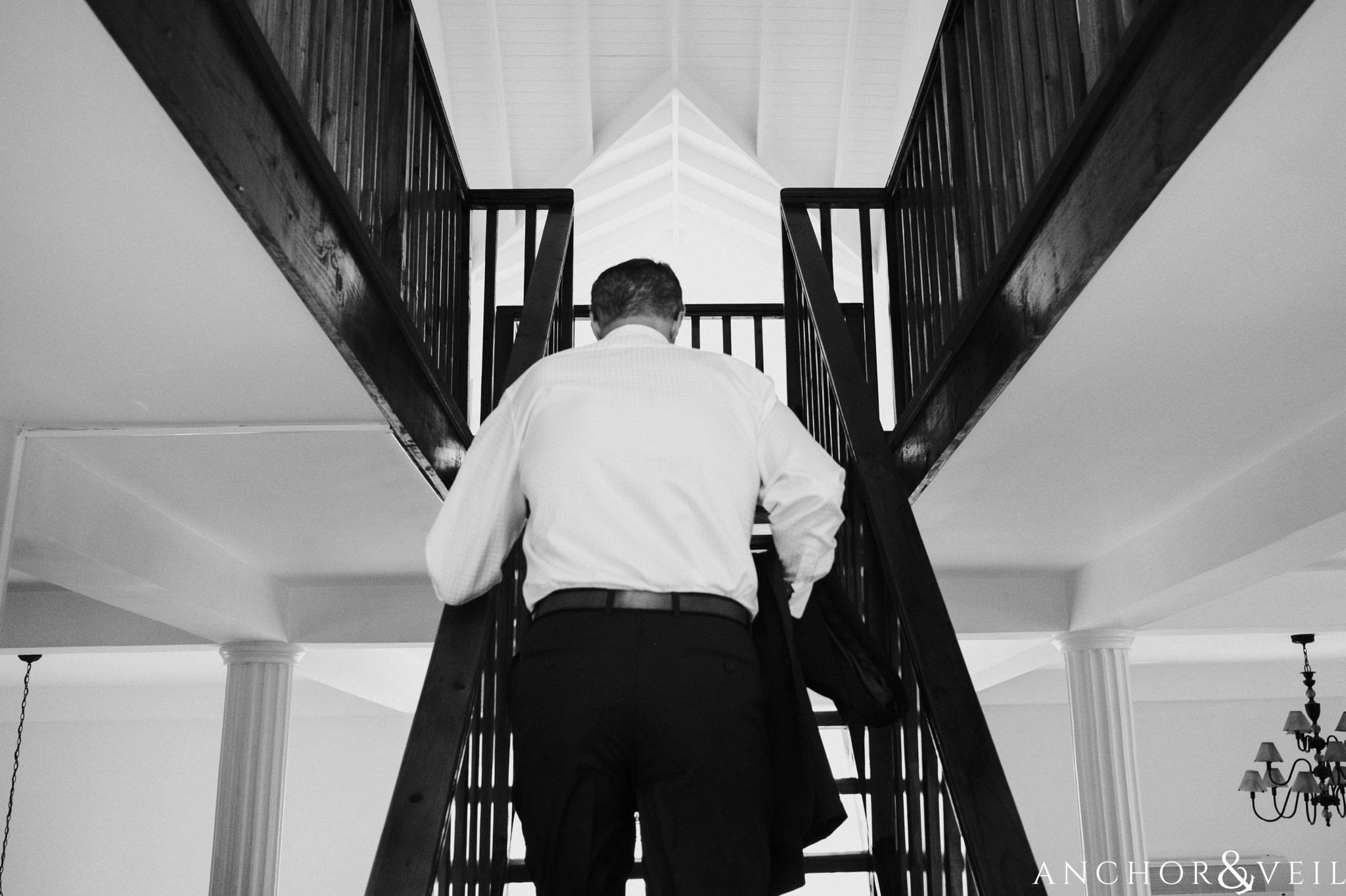 groom walking up the stairs