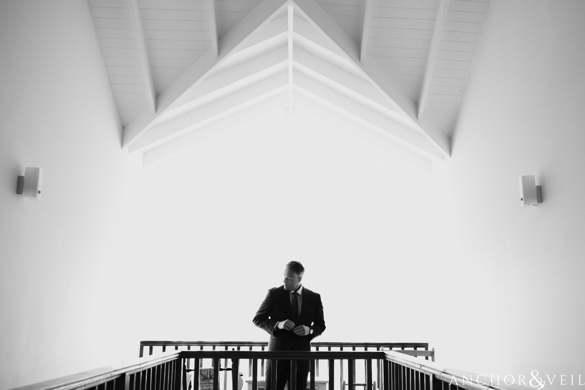 groom getting ready above the stairs During their Cap Maison destination Wedding In St Lucia