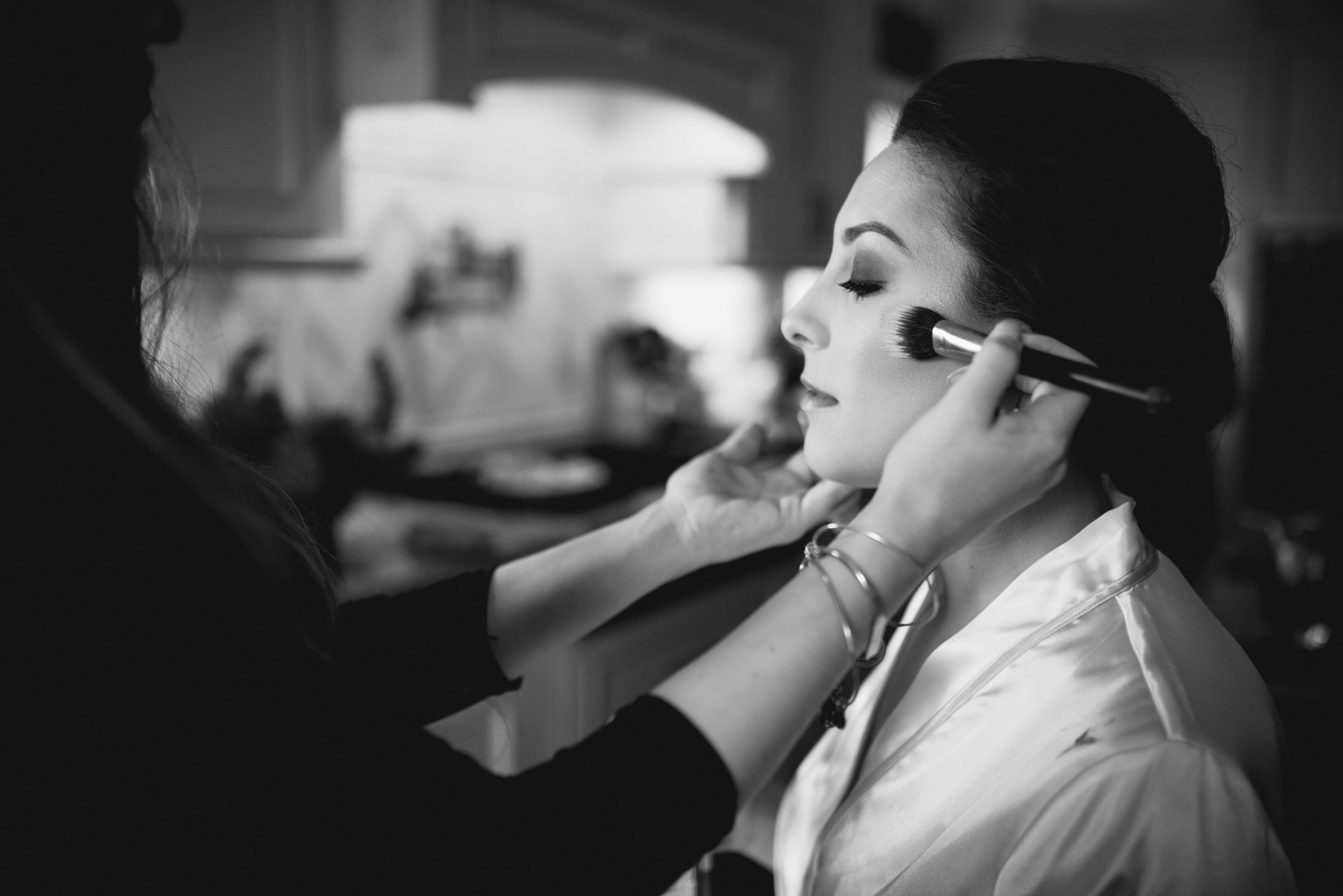 bride getting makeup done