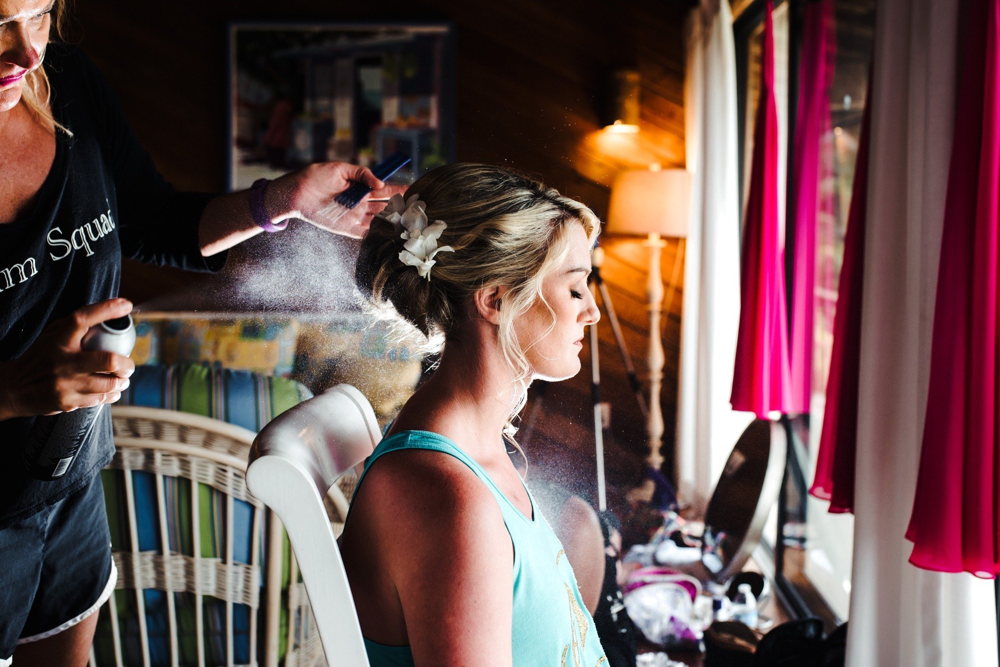 bride getting hair done before the wedding