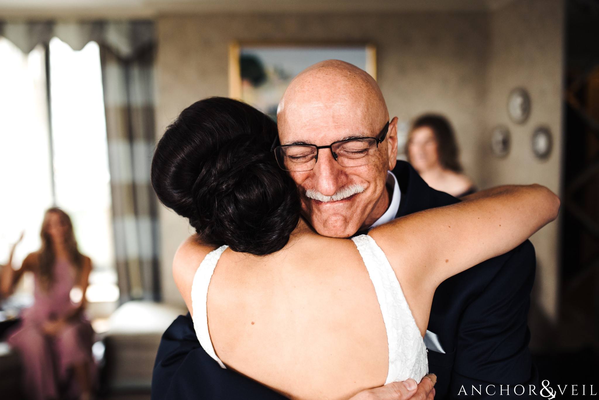 dad hugging daughter during their foundations for the Carolinas wedding 