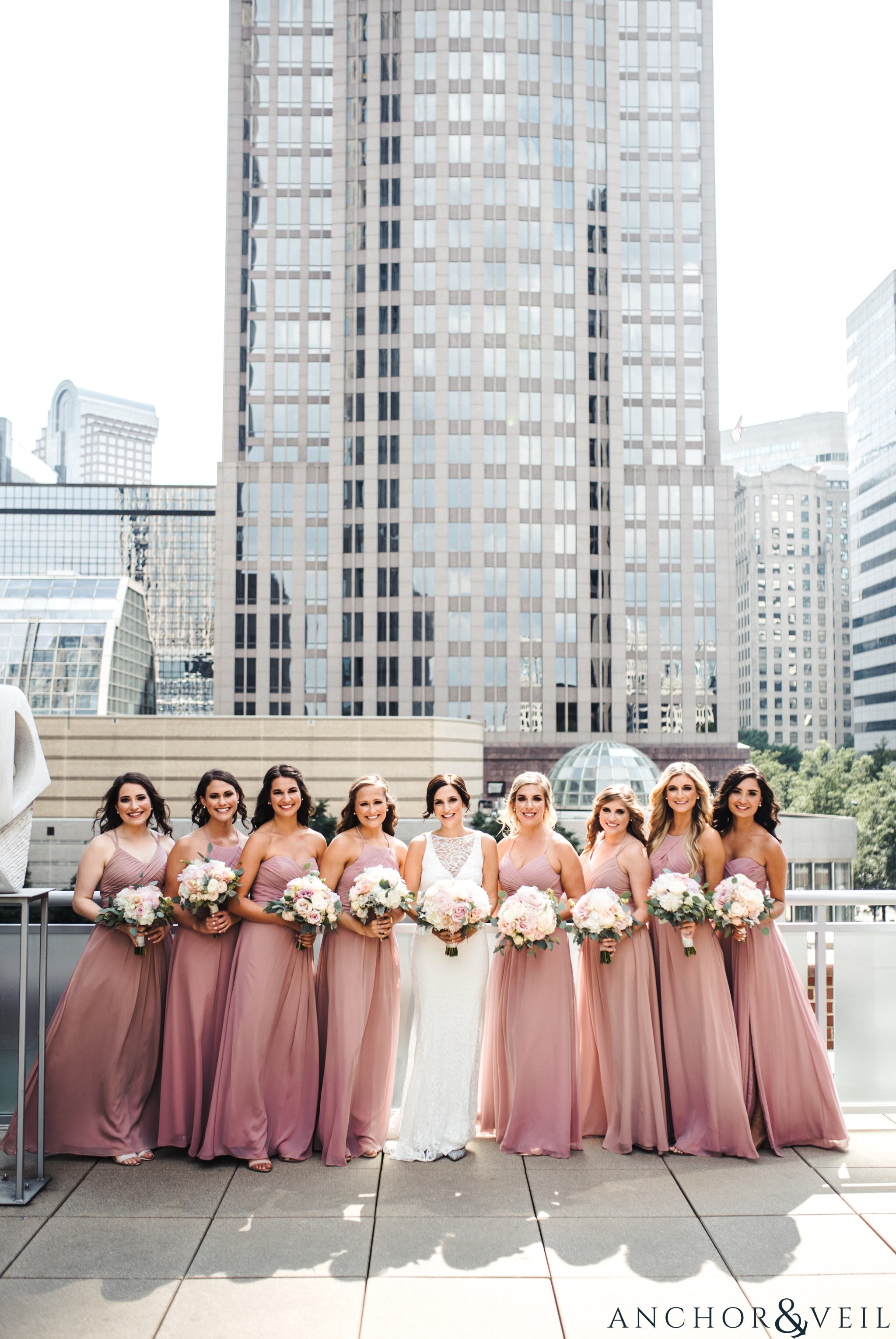 bridesmaids with the skyline during their foundations for the Carolinas wedding 