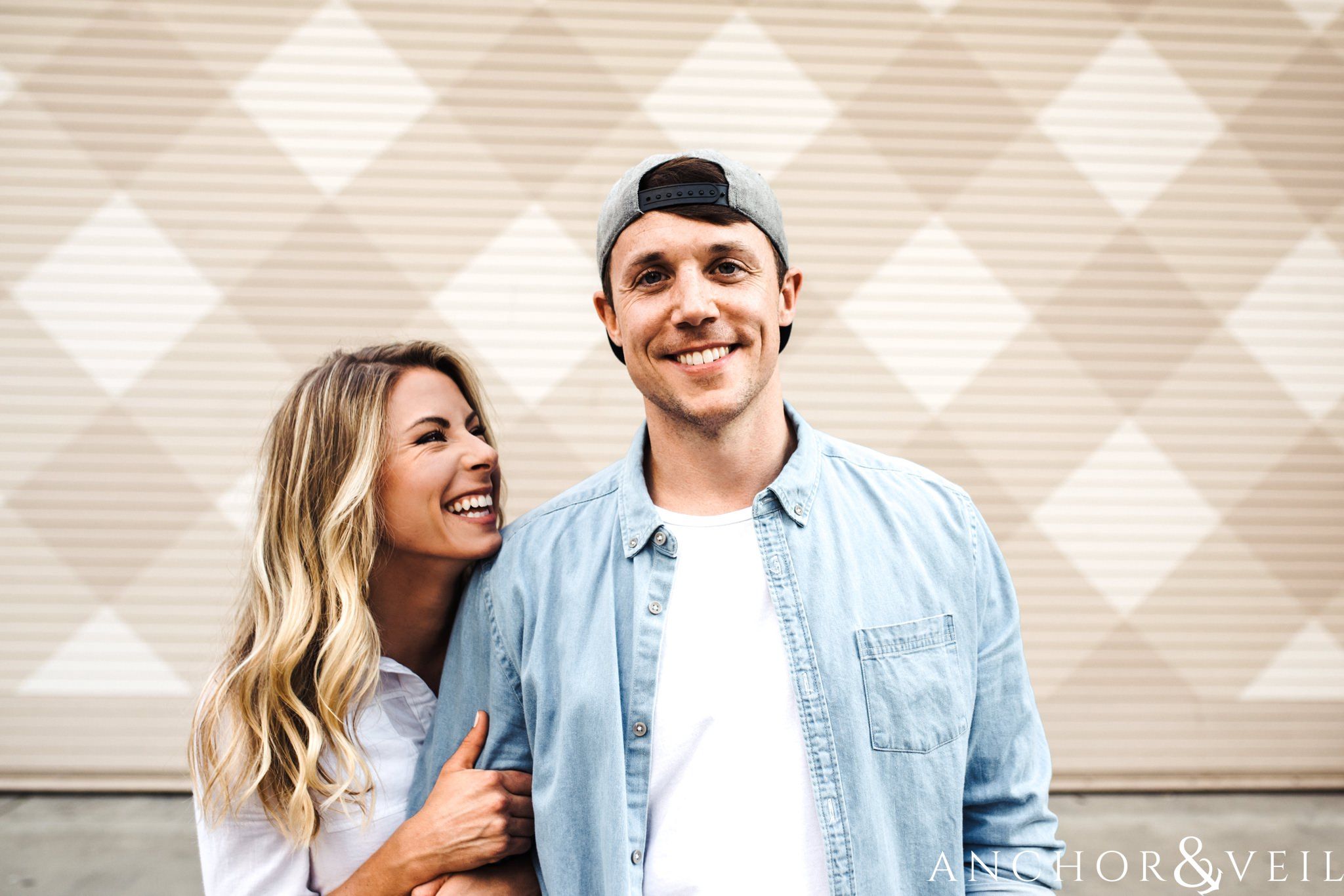 laughing with him uptown Charlotte engagement session