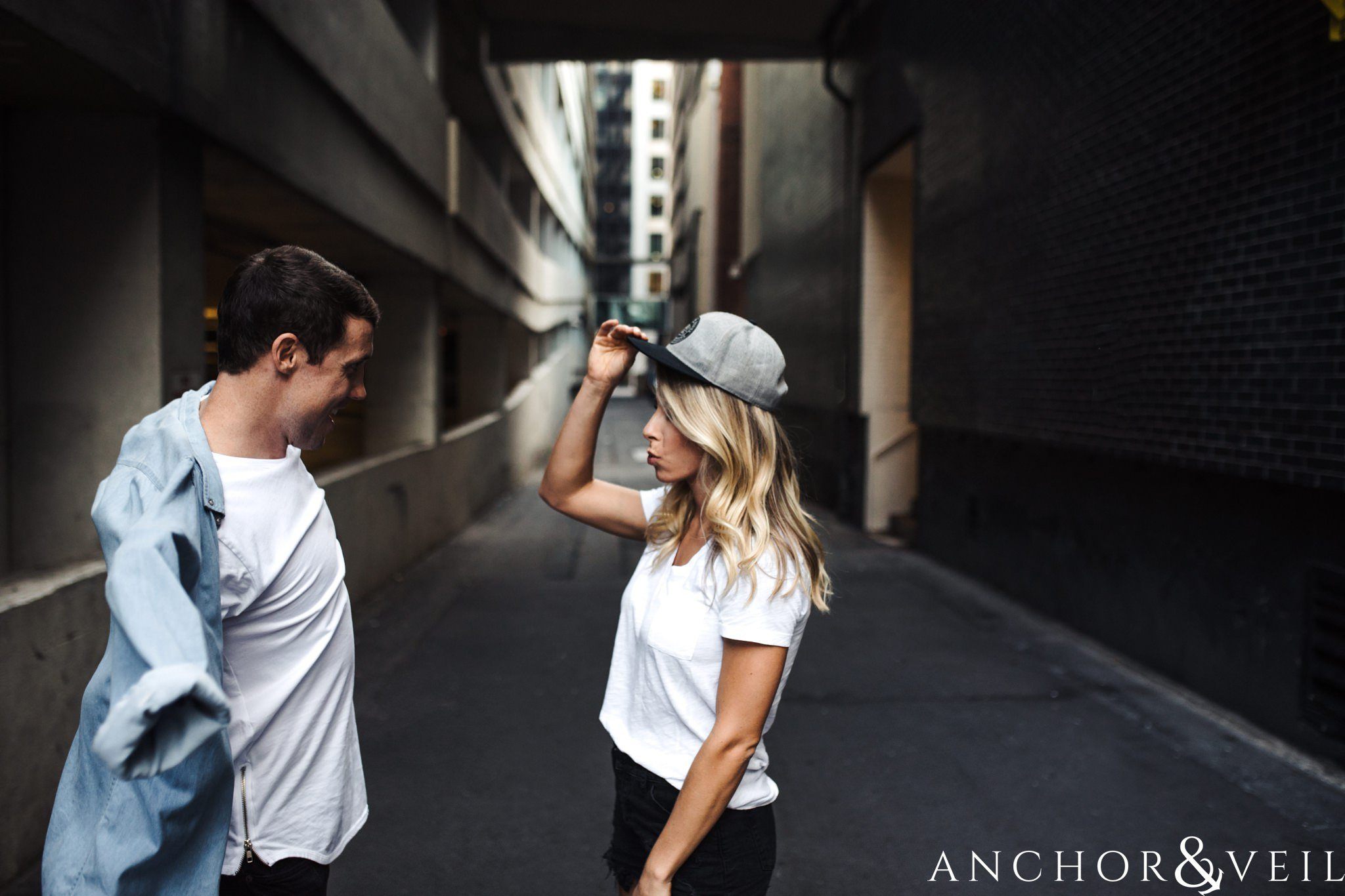 wearing his hat uptown Charlotte engagement session