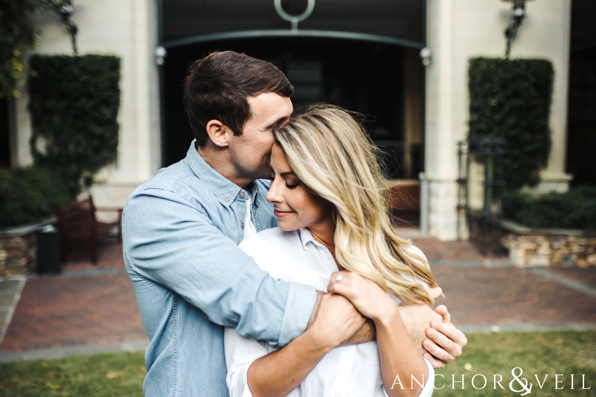 whispering in her ear uptown Charlotte engagement session