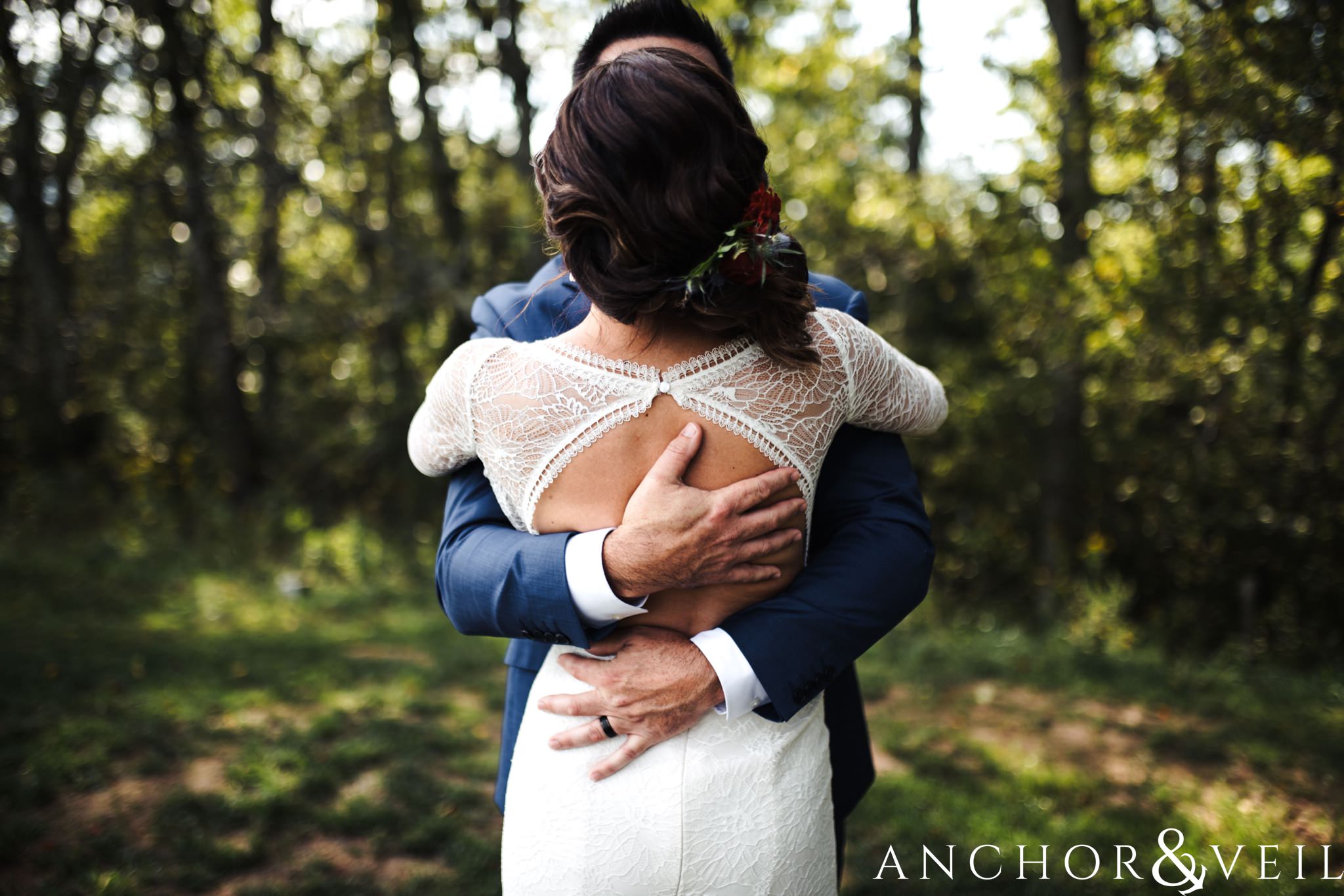 holding her tight during her The Venue Wedding in Asheville