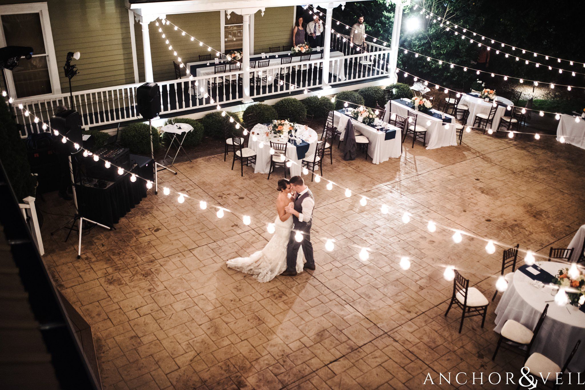 dancing under the lights during their Whitehead Manor Wedding