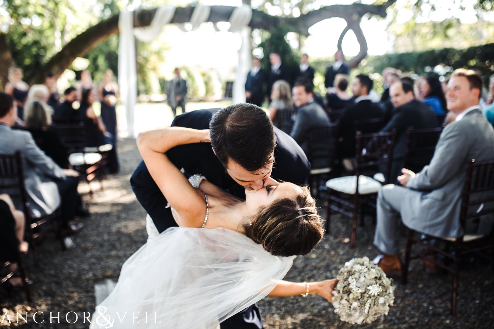 kissing at the altar during their Whitehead Manor Wedding
