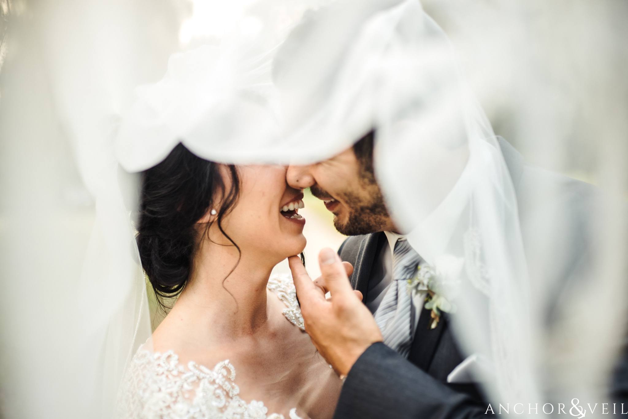 under the veil during their Cedar Room Wedding in Charleston Sc
