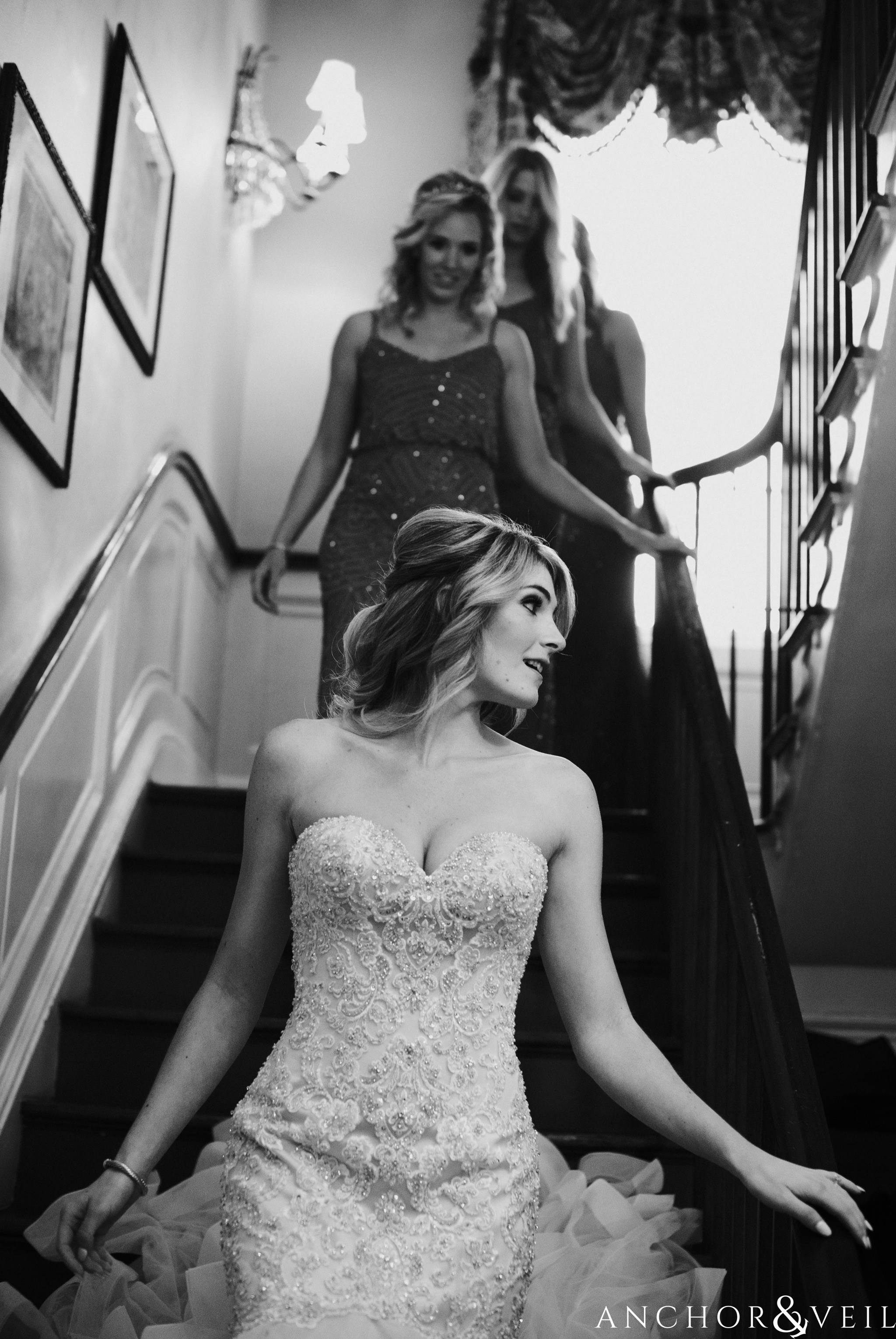 bride heading to the ceremony and walking down the stairs