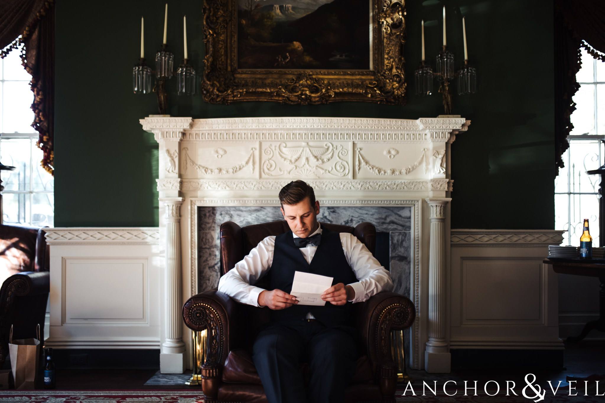 Groom reading his note during their William Aiken house Wedding in Charleston Sc