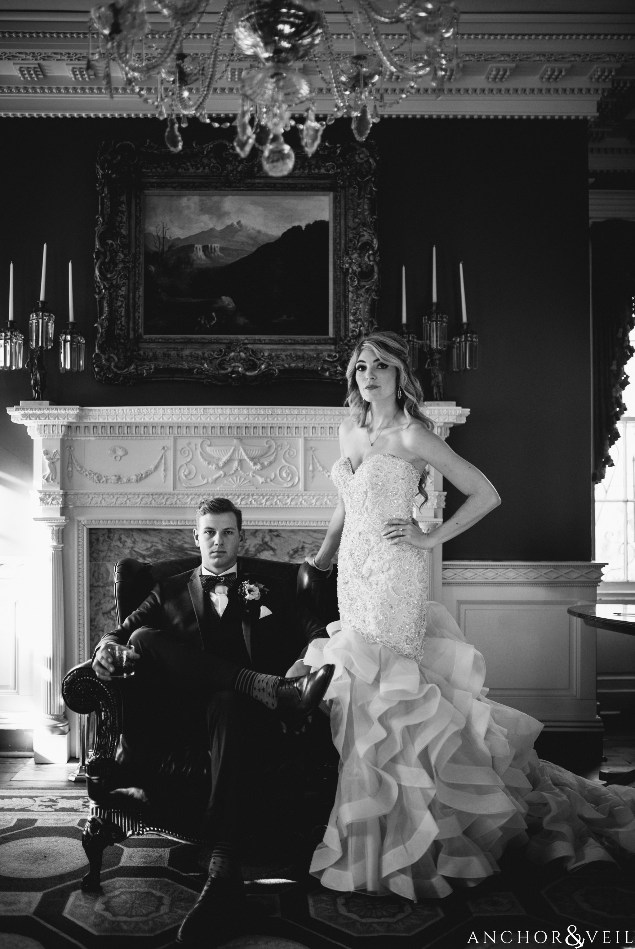 bride and groom near the fireplace during their William Aiken house Wedding in Charleston Sc