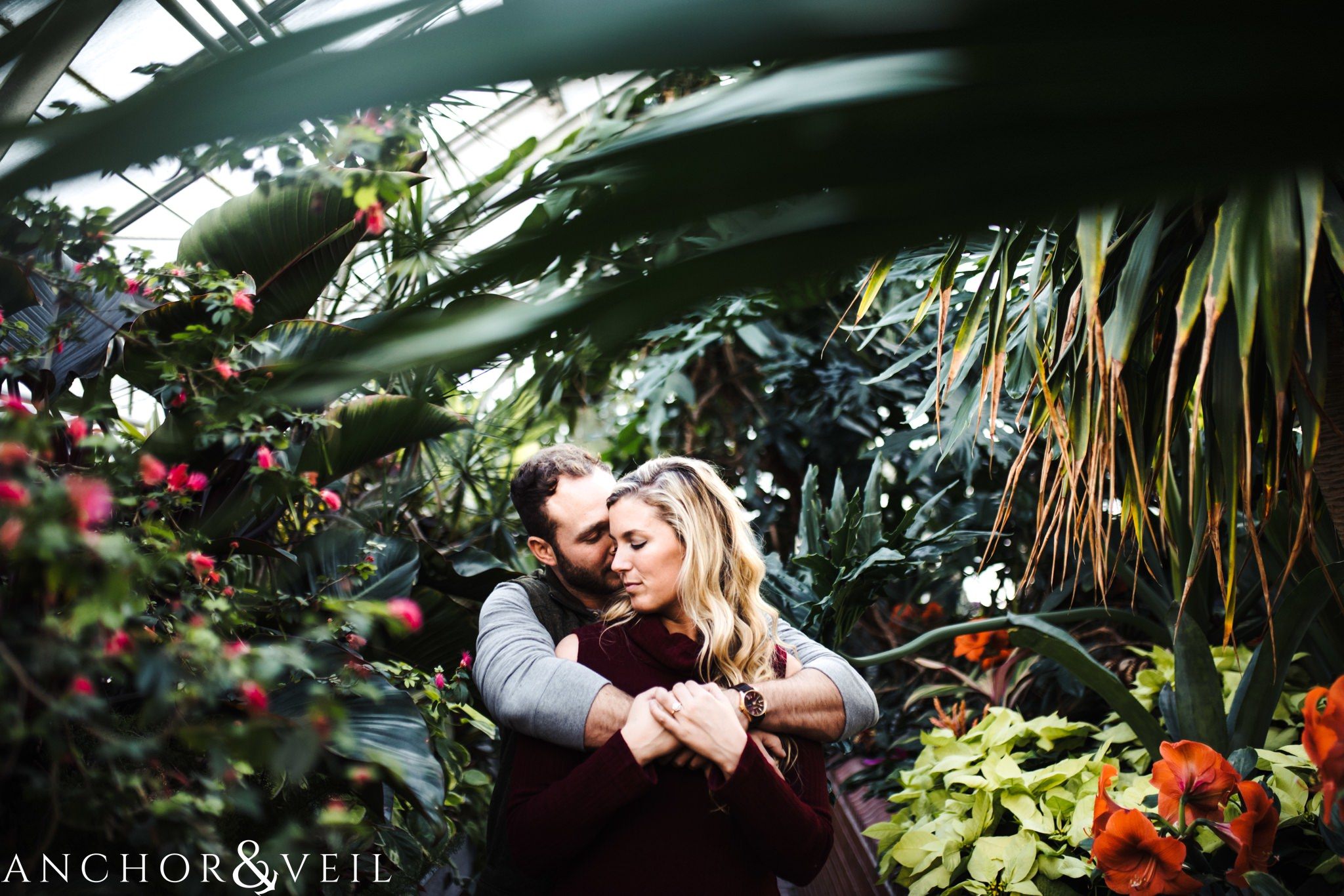 snuggled up during their Snowy Biltmore Engagement Session