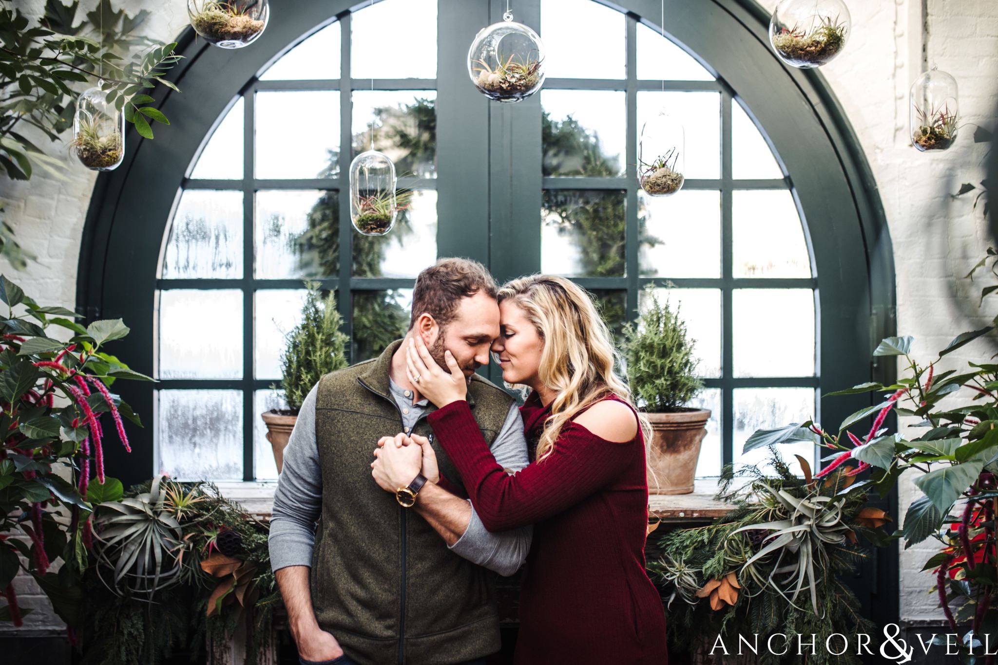 with the terrariums during their Snowy Biltmore Engagement Session