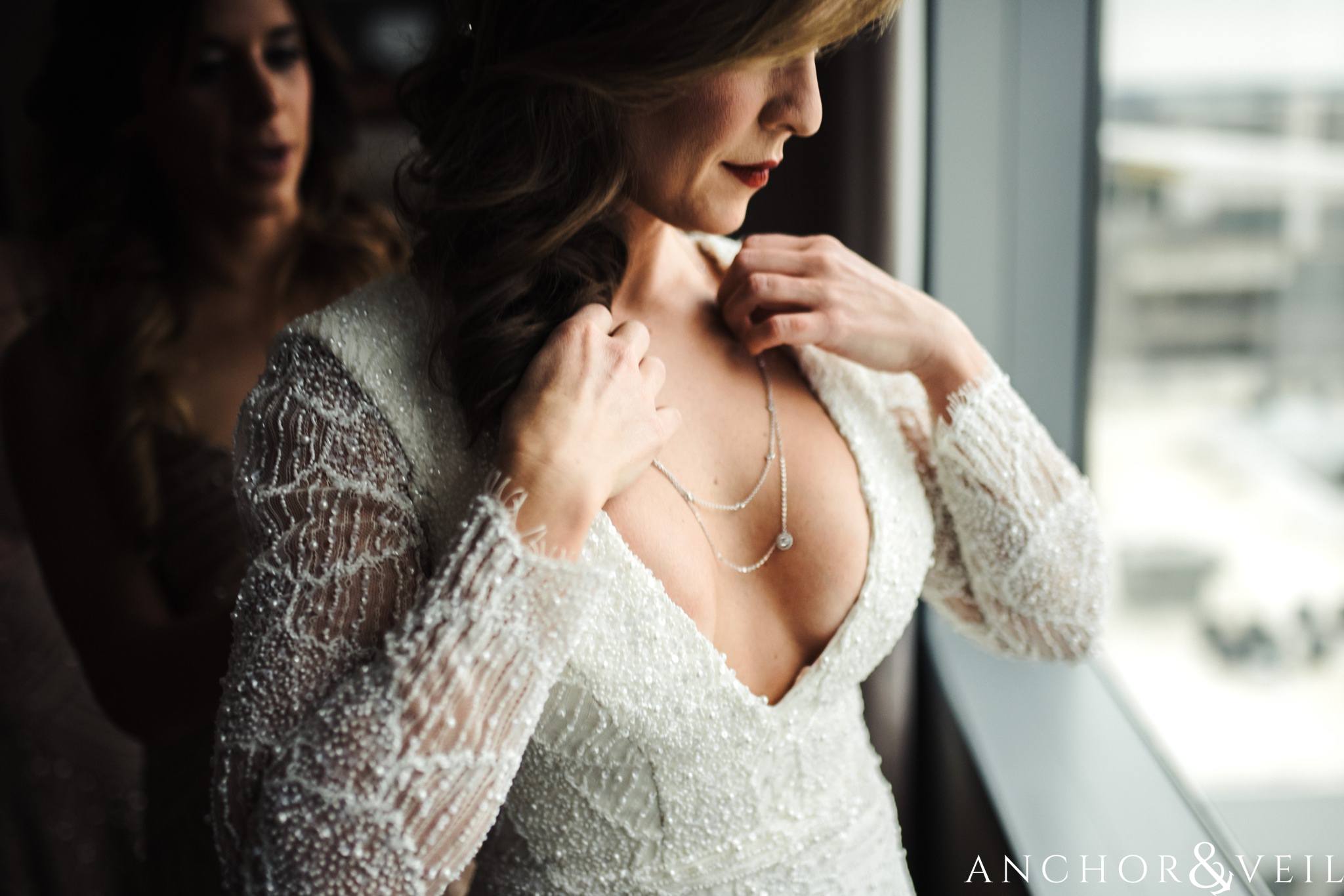 brides necklace during their New Years Even uptown Charlotte Wedding