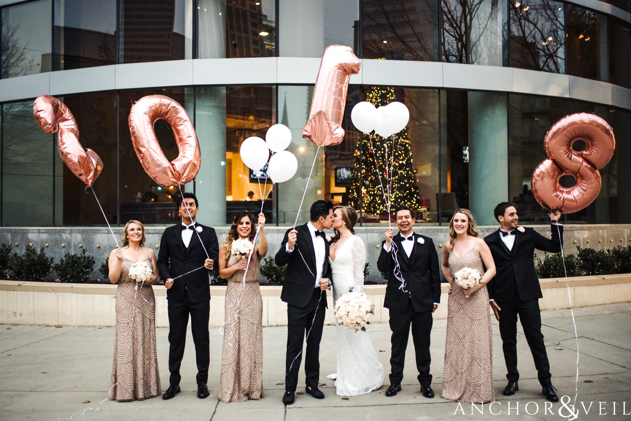 bridal party balloons during their New Years Even uptown Charlotte Wedding