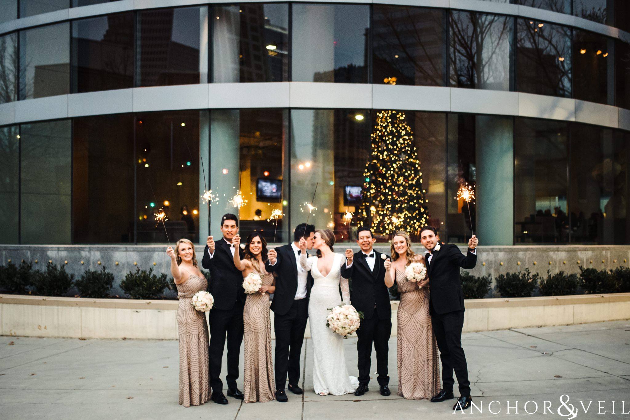 bridal party sparklers during their New Years Even uptown Charlotte Wedding