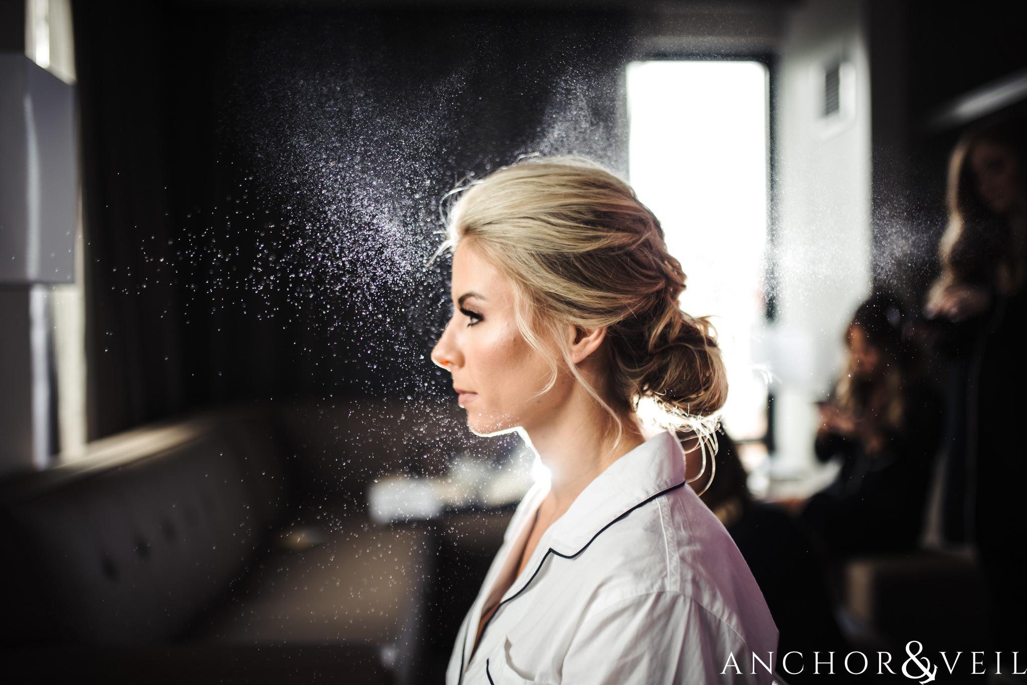 bride with hairspray during their Downtown Asheville Wedding 