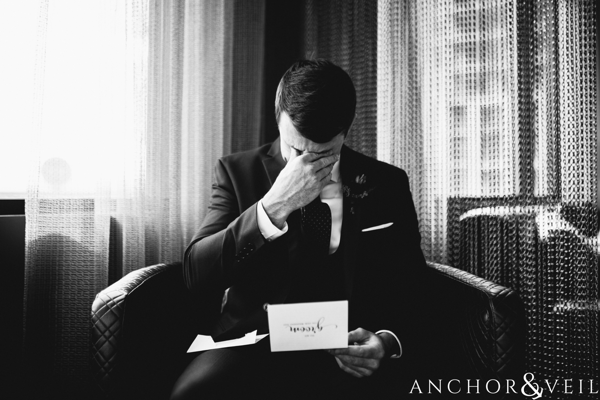 groom reading the letter during their Downtown Asheville Wedding