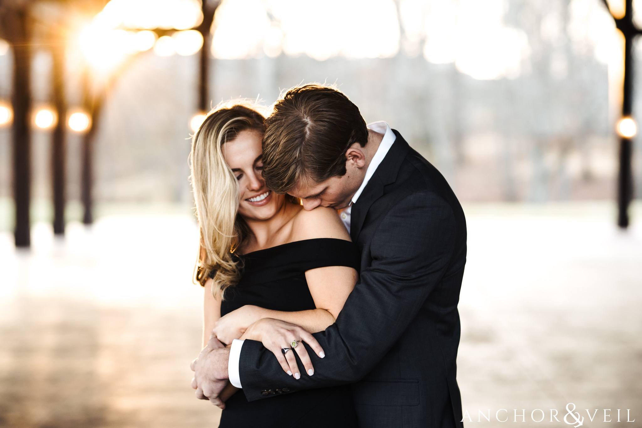 kissing her shoulder during their Dale Earnhardt Inc Engagement Session Mooresville